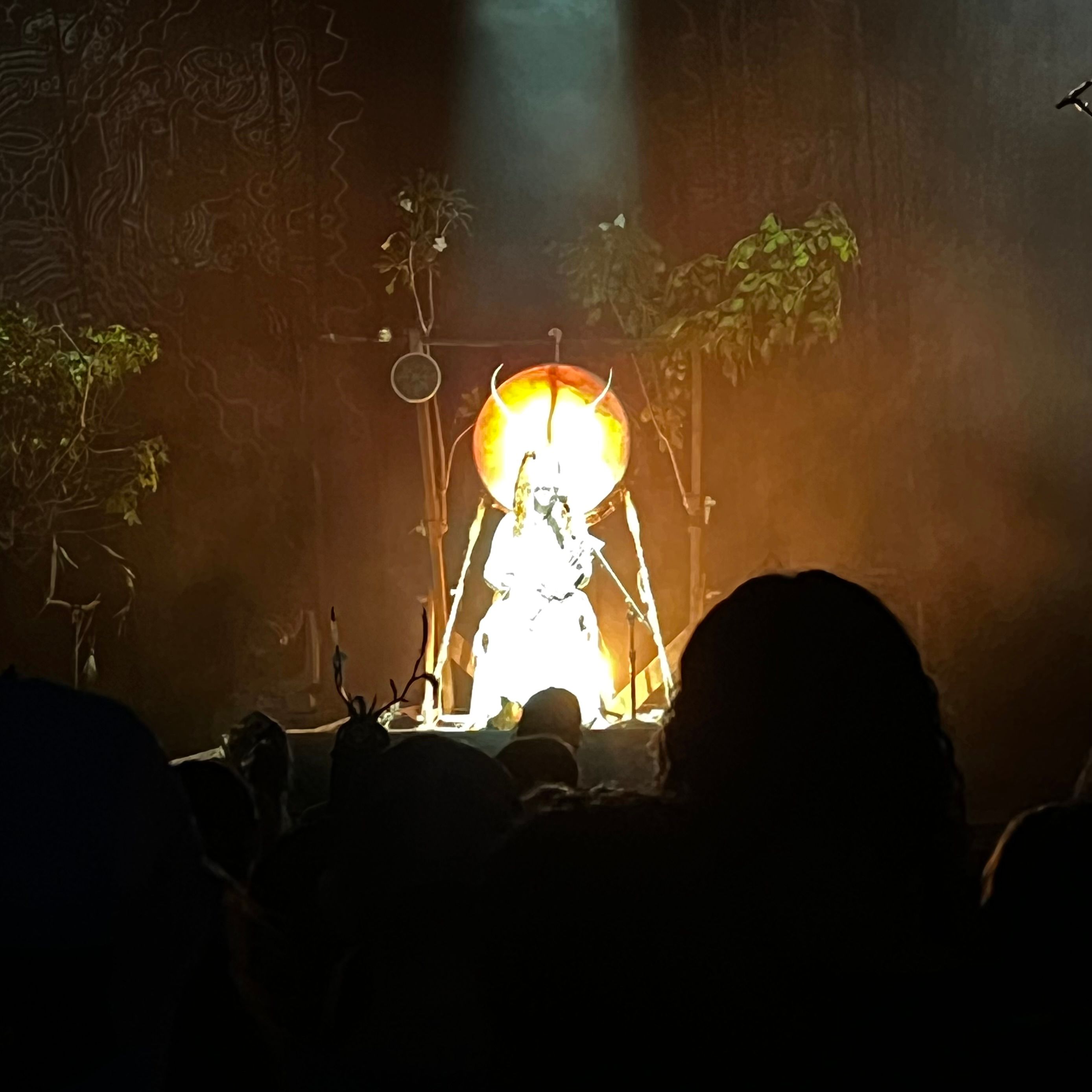 An overexposed shot of a performer on stage.