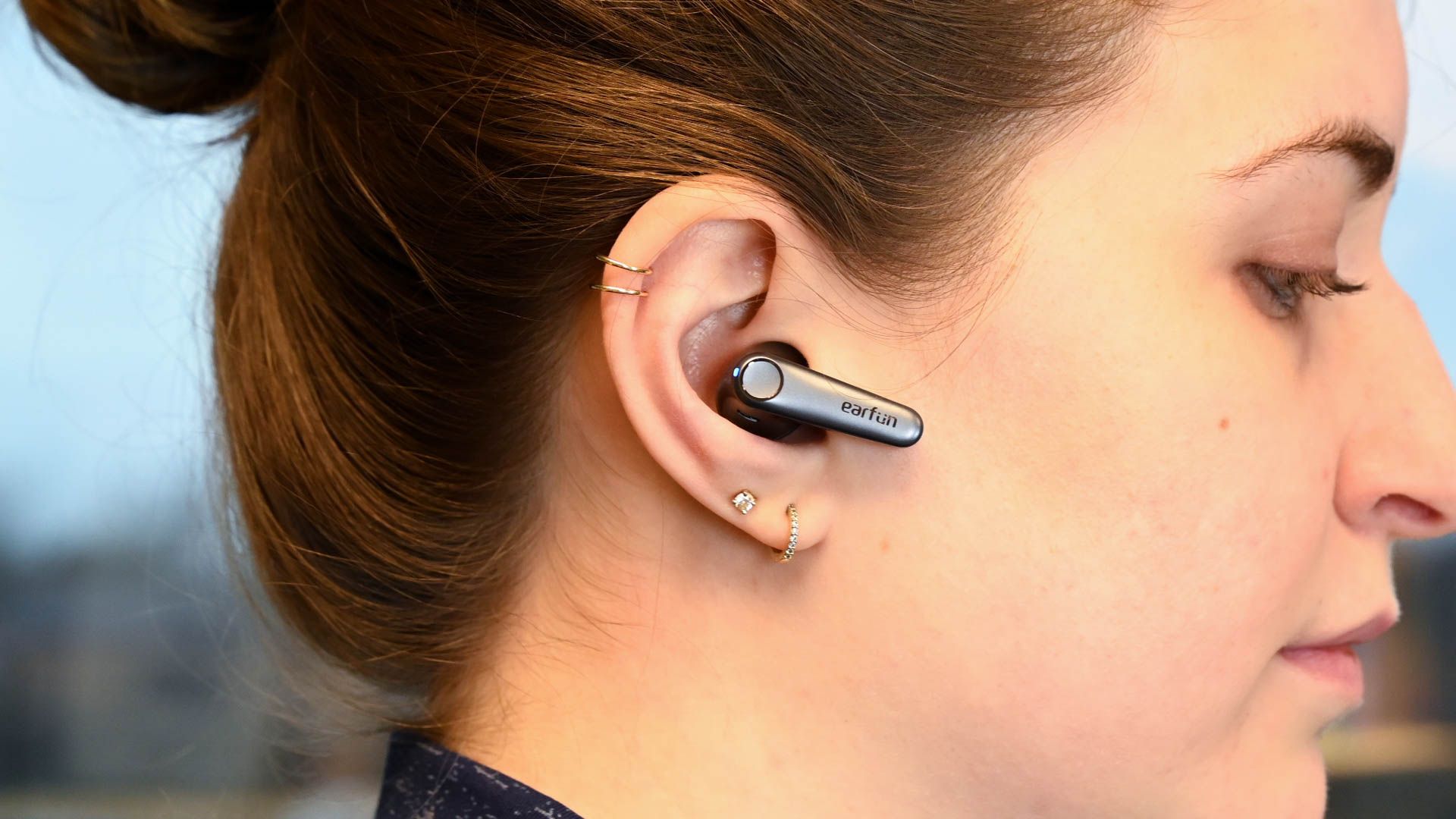 Person using the EarFun Air Pro 3 earbuds.