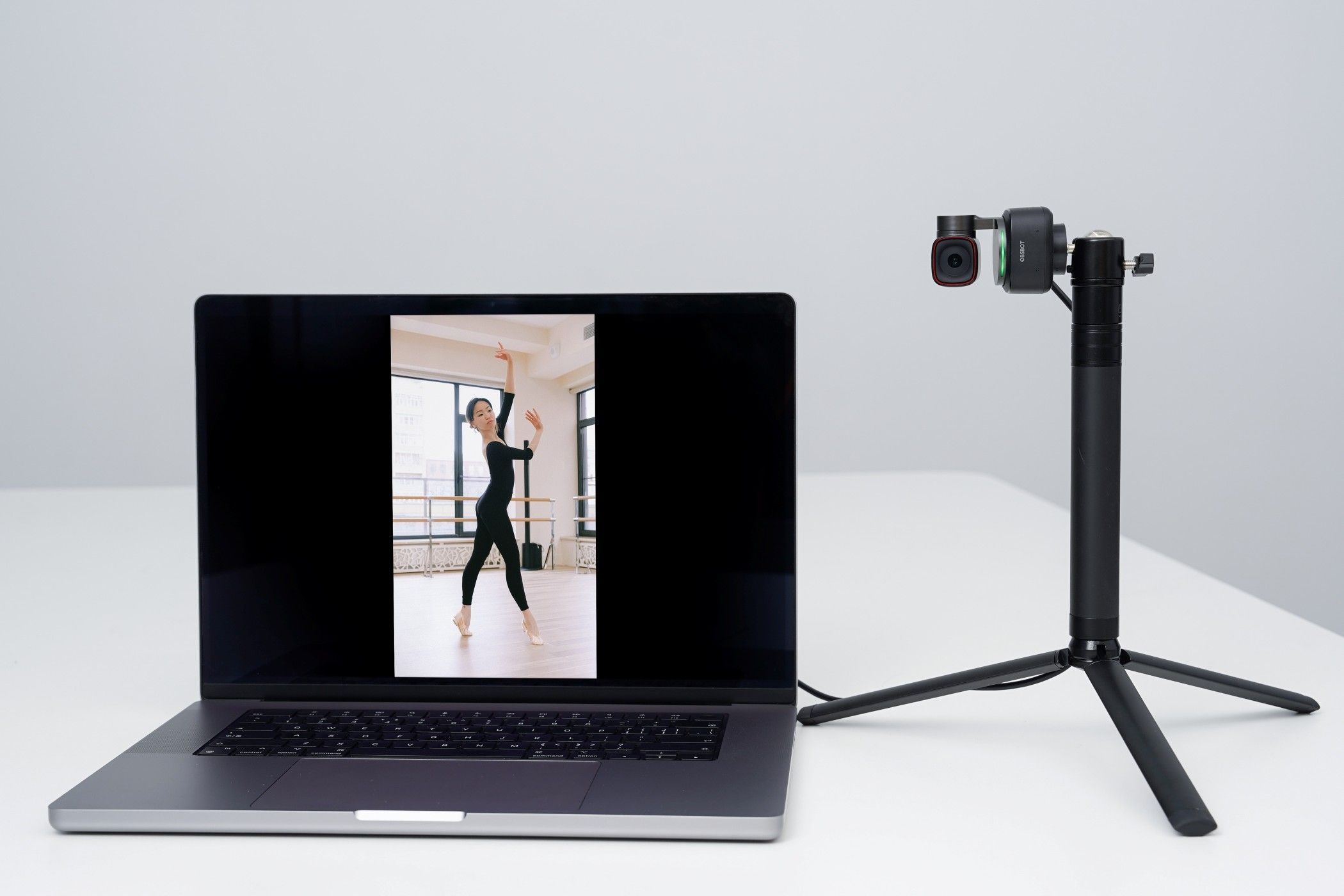 A Woman Shooting Her Performance Portraits Using Voice Commands 