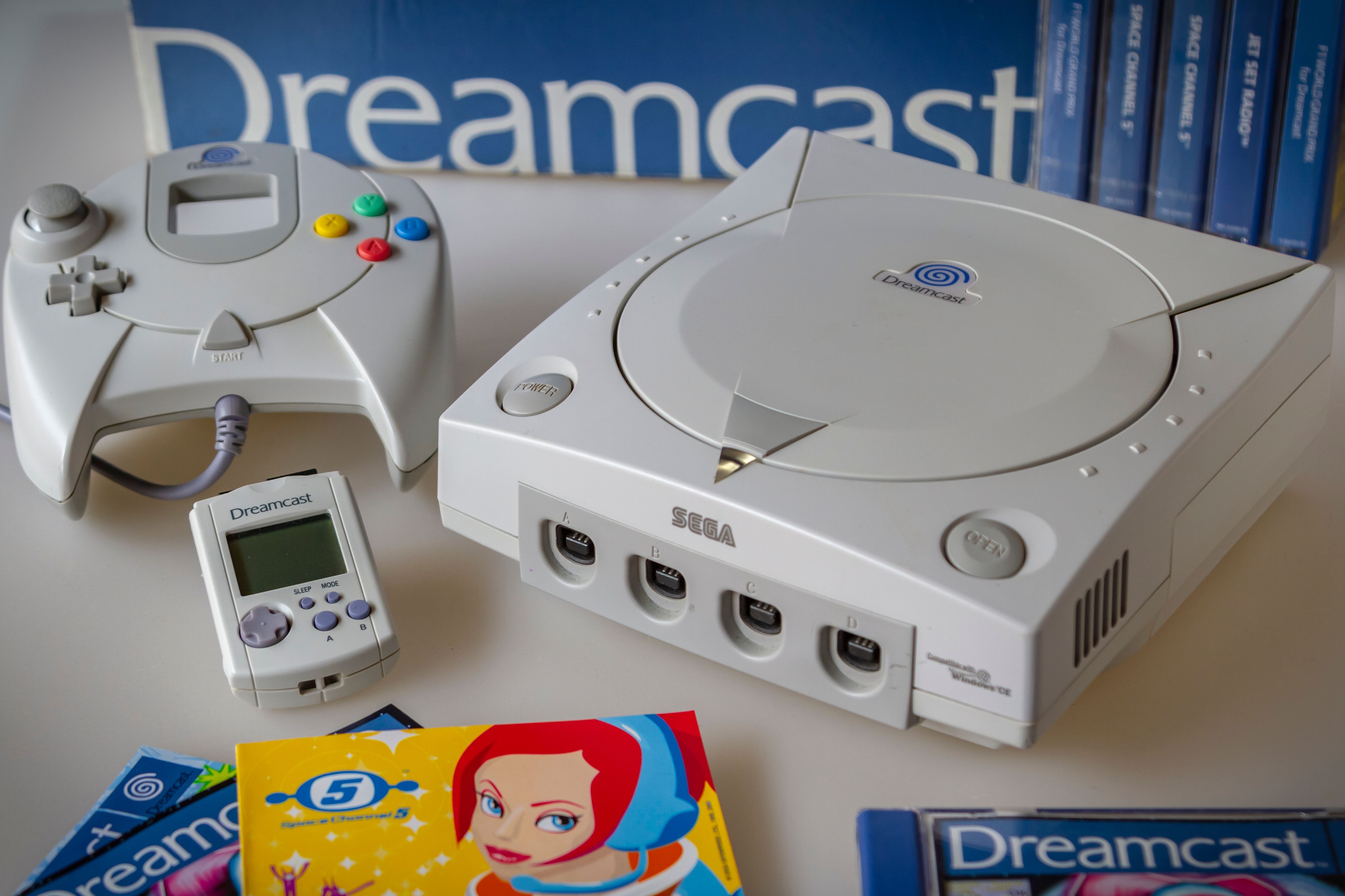 Sega Dreamcast with controller, VMU, and Space Channel 5.