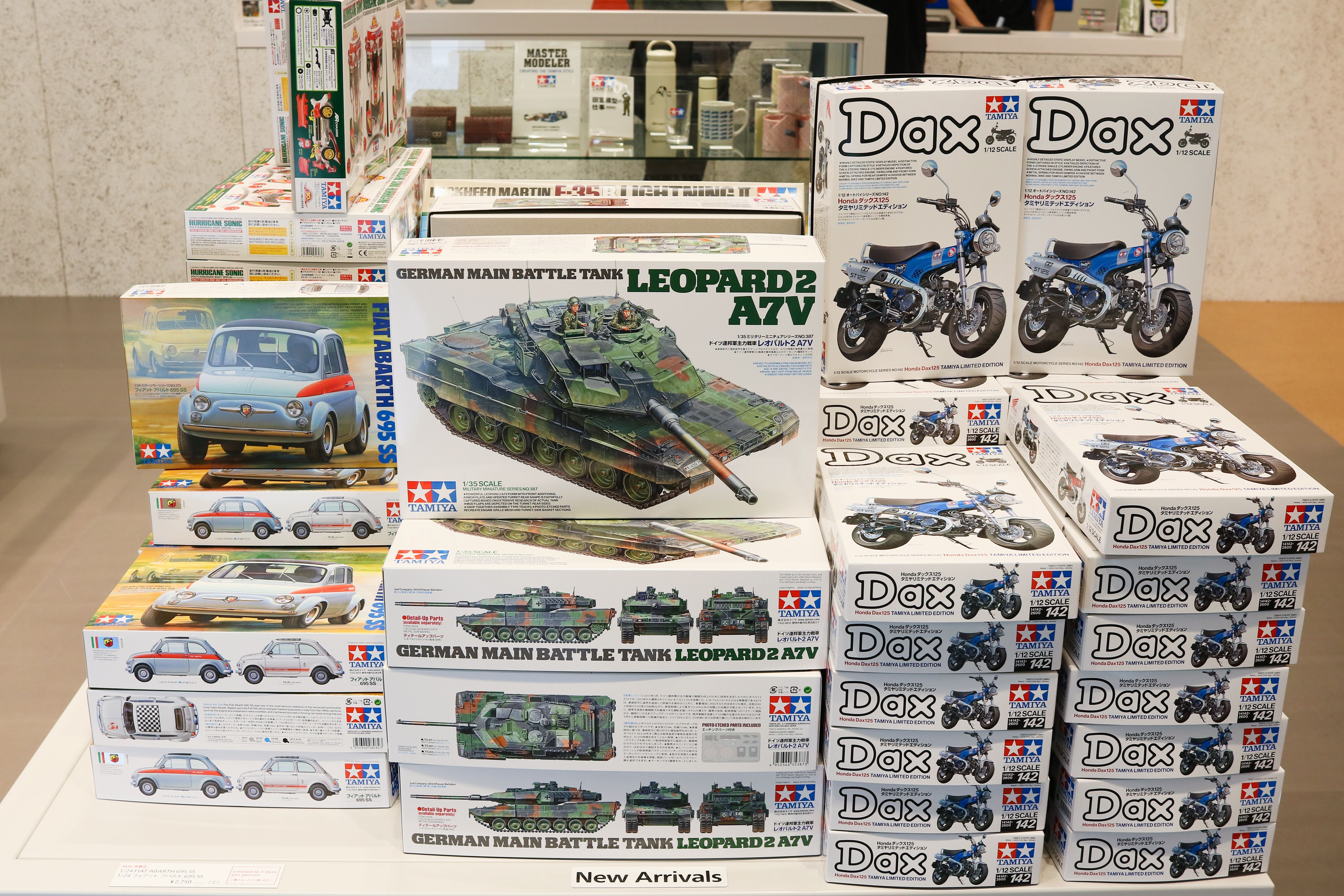 Boxes of new Tamiya models (a Fiat classic Fiat car, a Honda minibike and a Leopard tank) in Tamiya Plamodel Factory Tokyo.