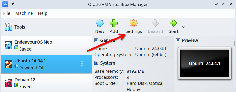 VirtualBox manager with a red arrow pointing to the Settings button that features a yellow cog icon.