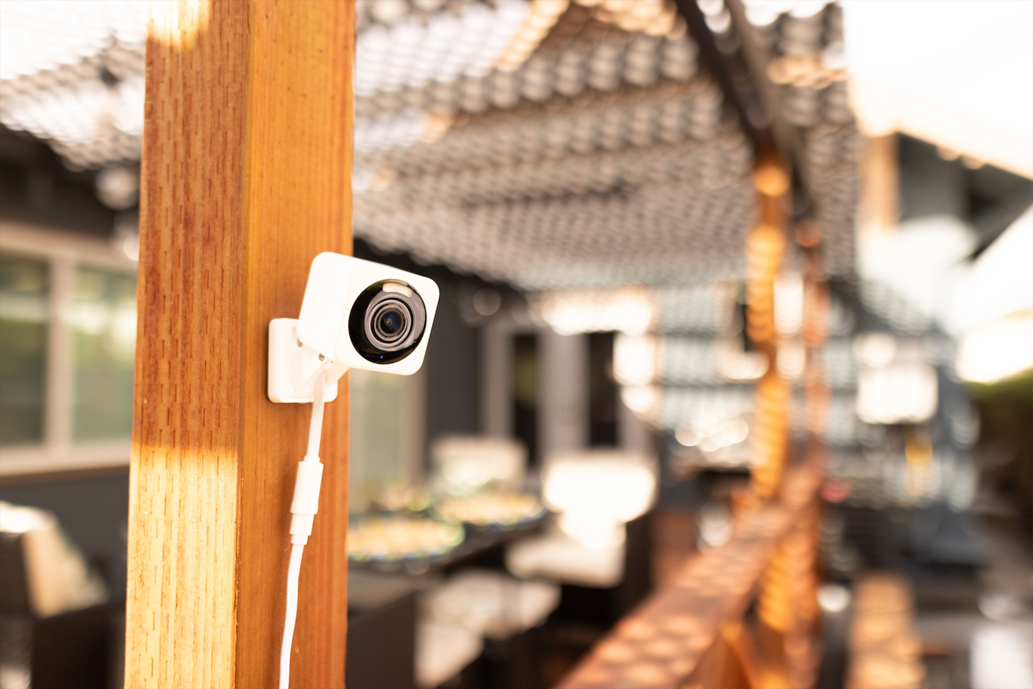 Wyze Cam V4 Wi-Fi camera mounted to a porch post.