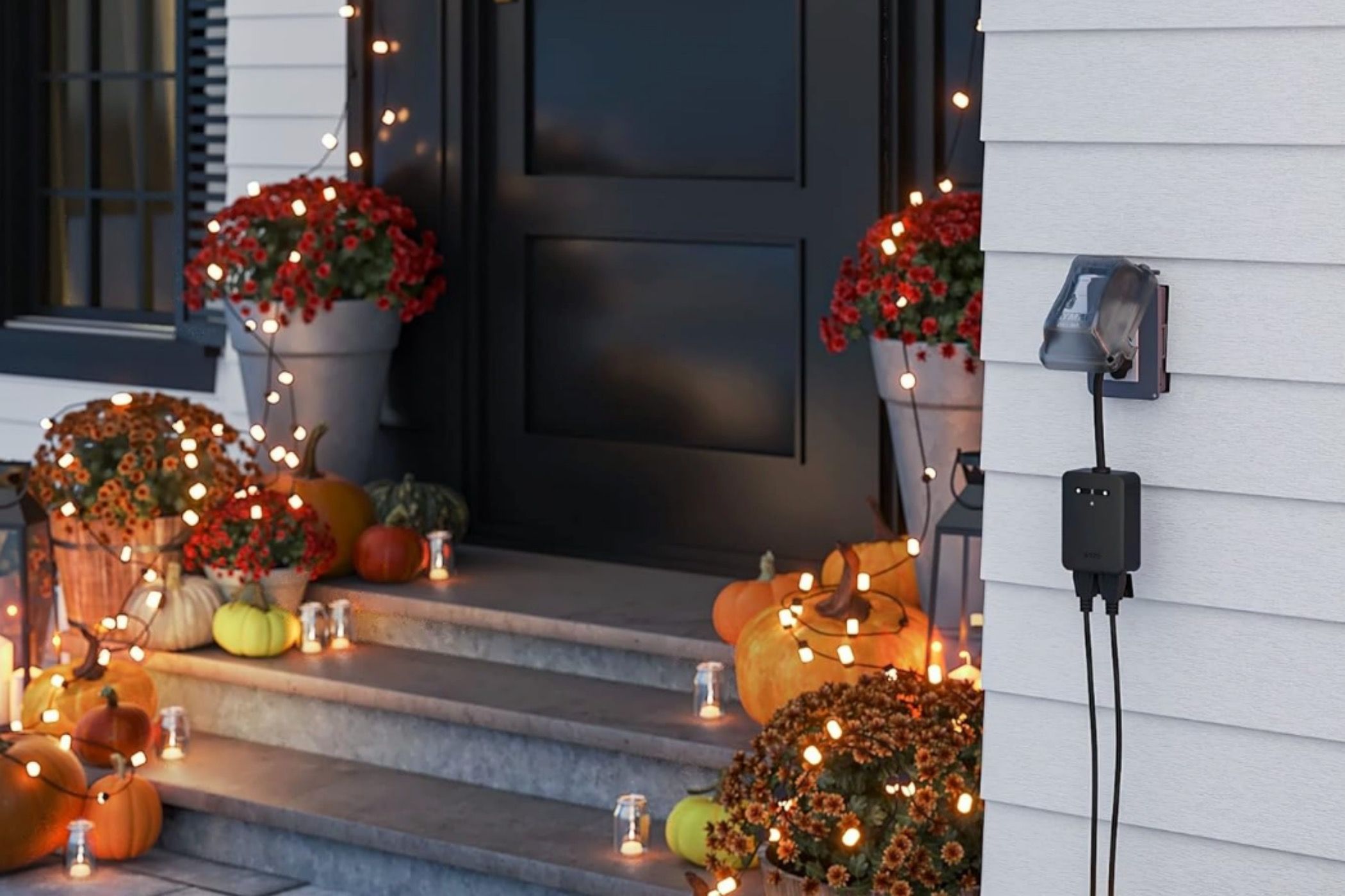 A Wyze Plug Outdoor lighting up Christmas lights in a doorway.