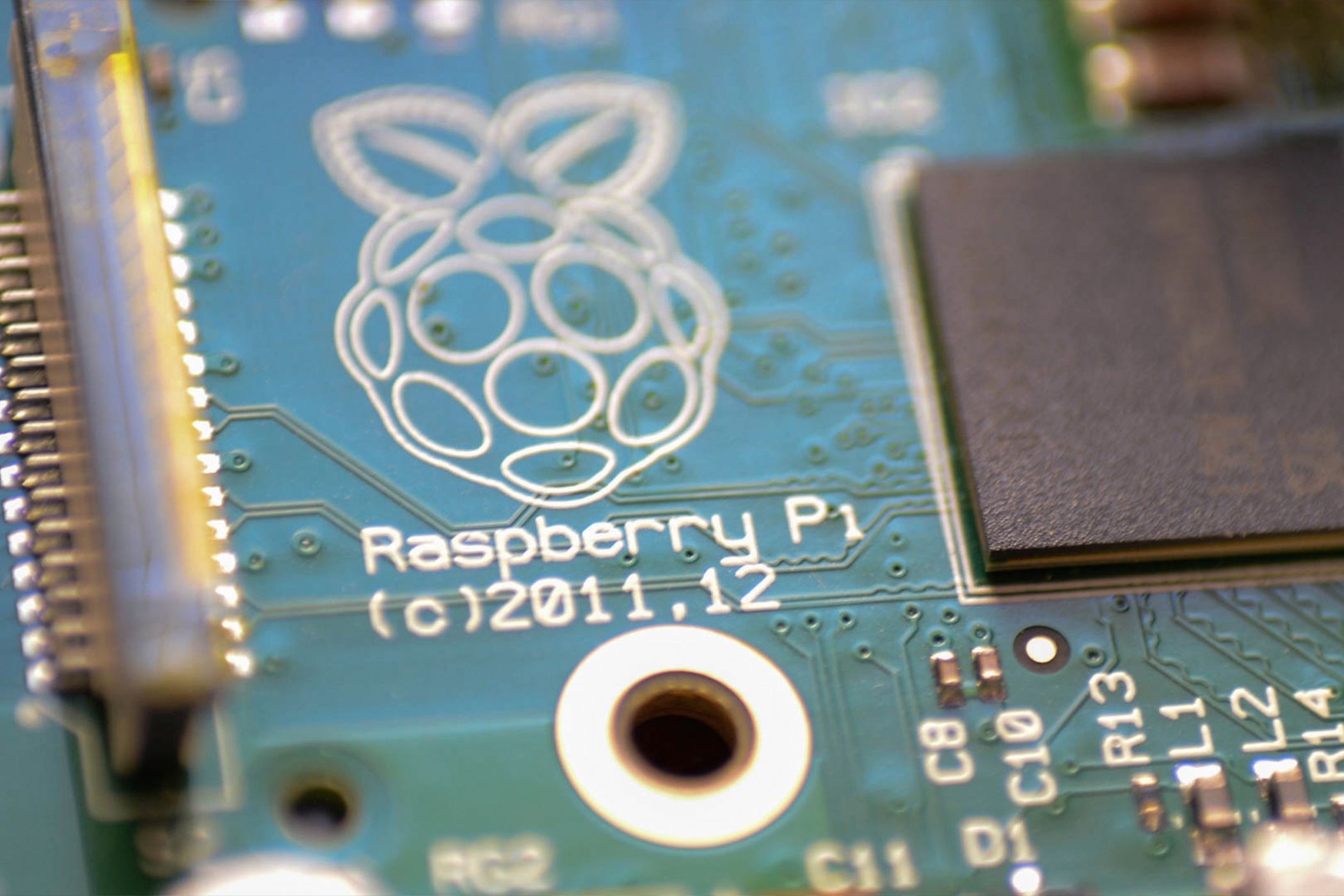 Close-up of the Pi logo on a first-generation Pi SBC.