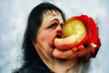 A Midjourney V1 render of a woman eating an apple. It's horrifying and gross.