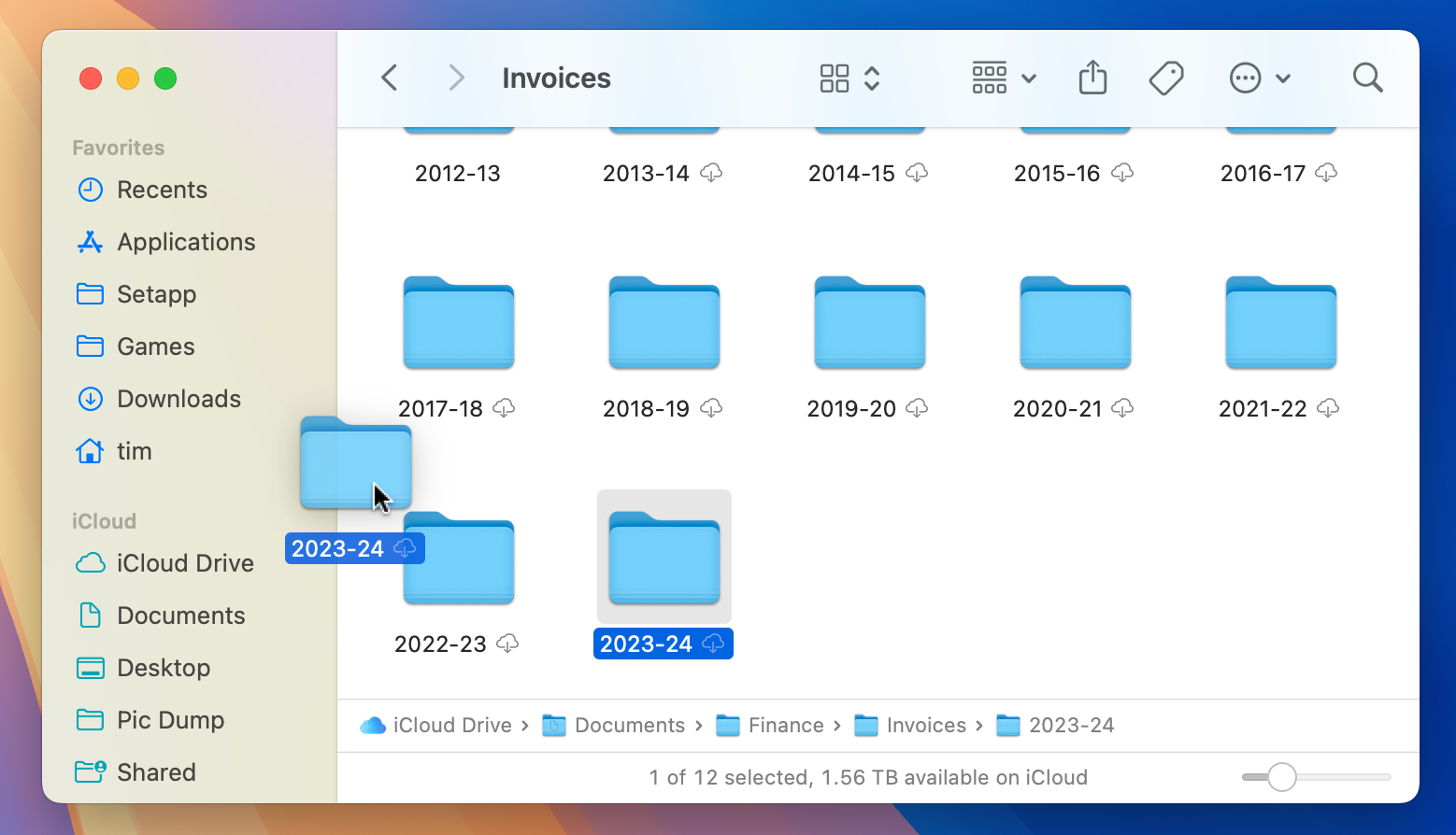 Adding a folder to the Finder sidebar by clicking and dragging.