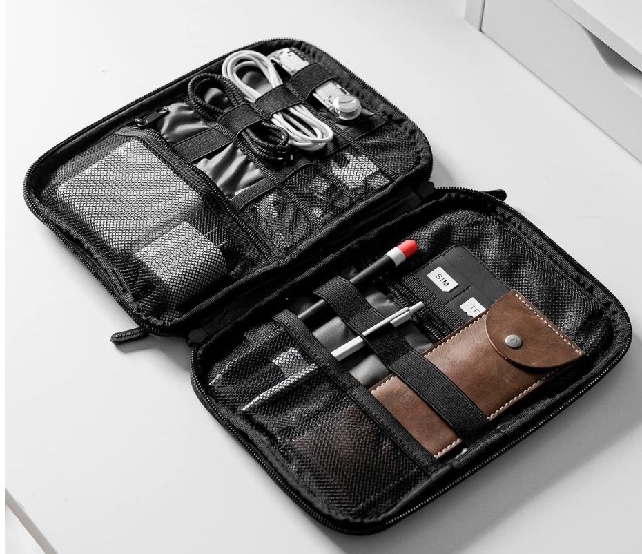 A BAGSMART Electronic Organizer packed with cables and accessories.