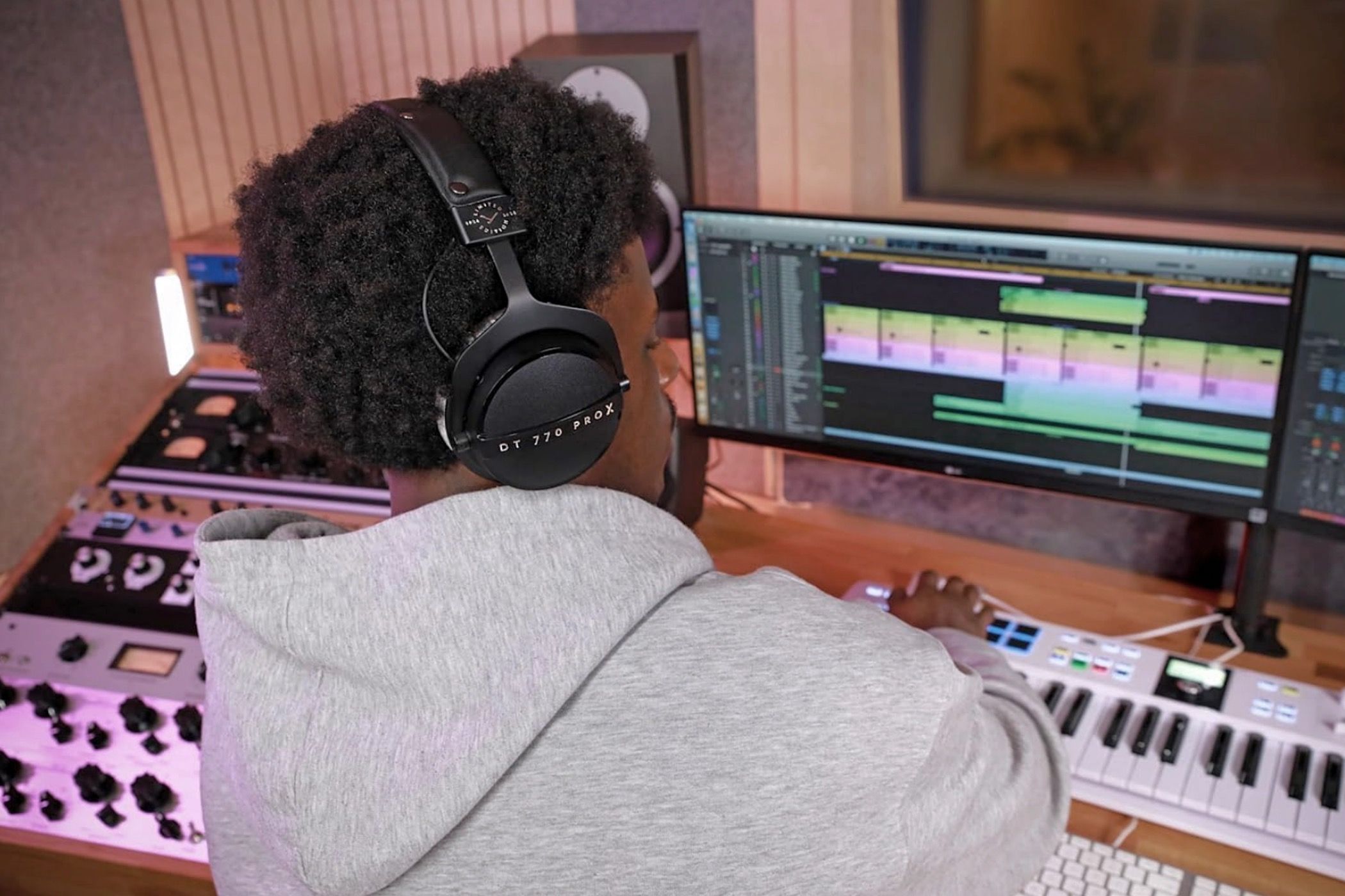 A man in the studio wearing the Beyerdynamic DT 770 Pro X Limited Edition headphones.