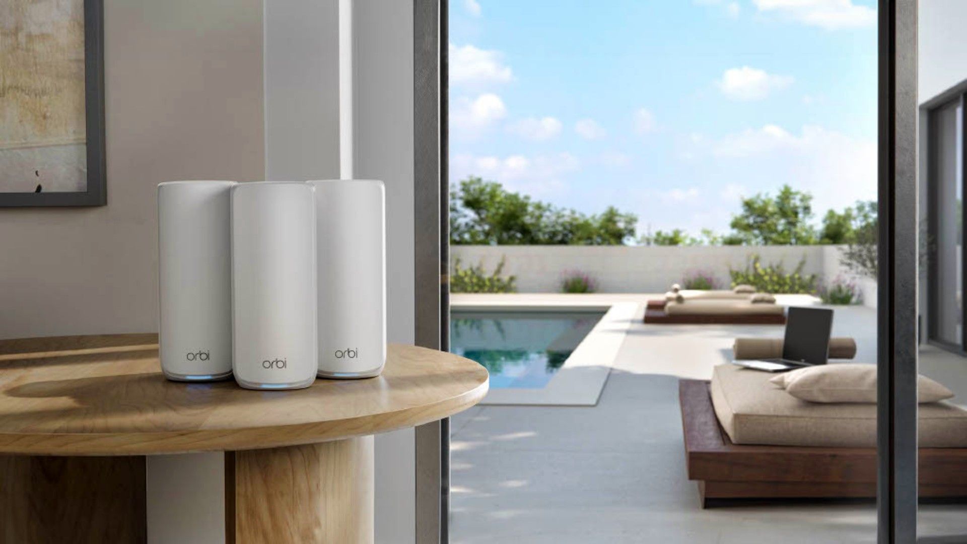 NETGEAR Orbi 870 Series Mesh Wi-Fi on a table near the door