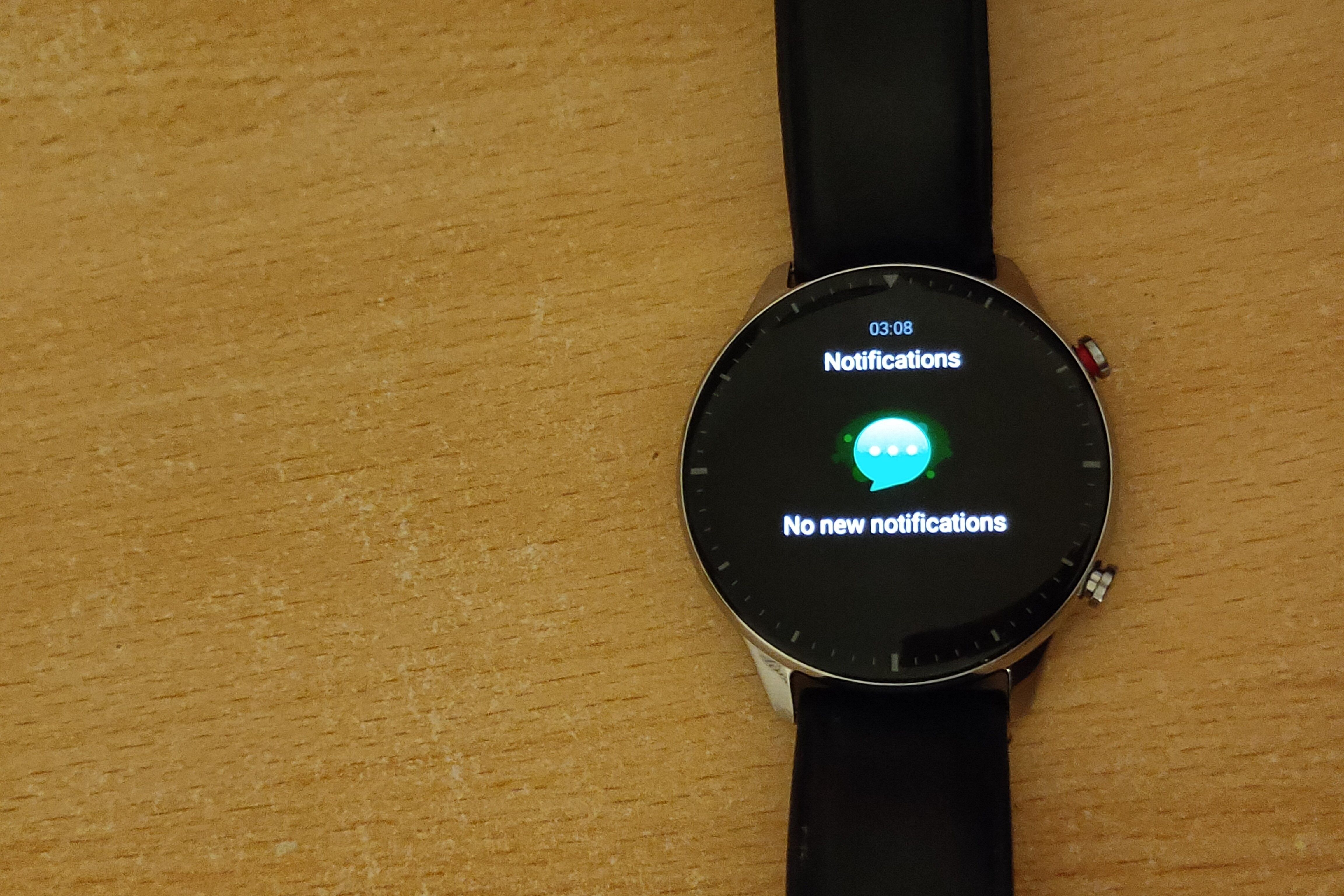 A smartwatch displaying "no new notifications" on the screen.