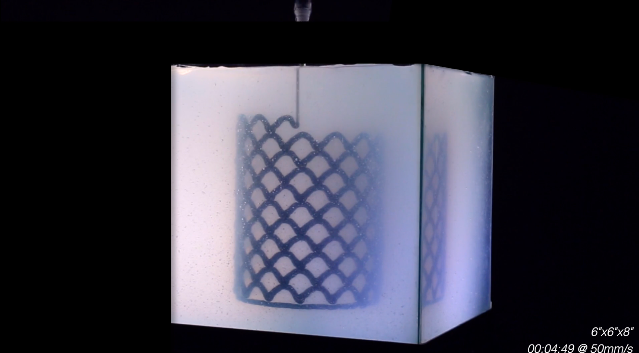 A rapid liquid 3D printer with a complex object visible in the gel.