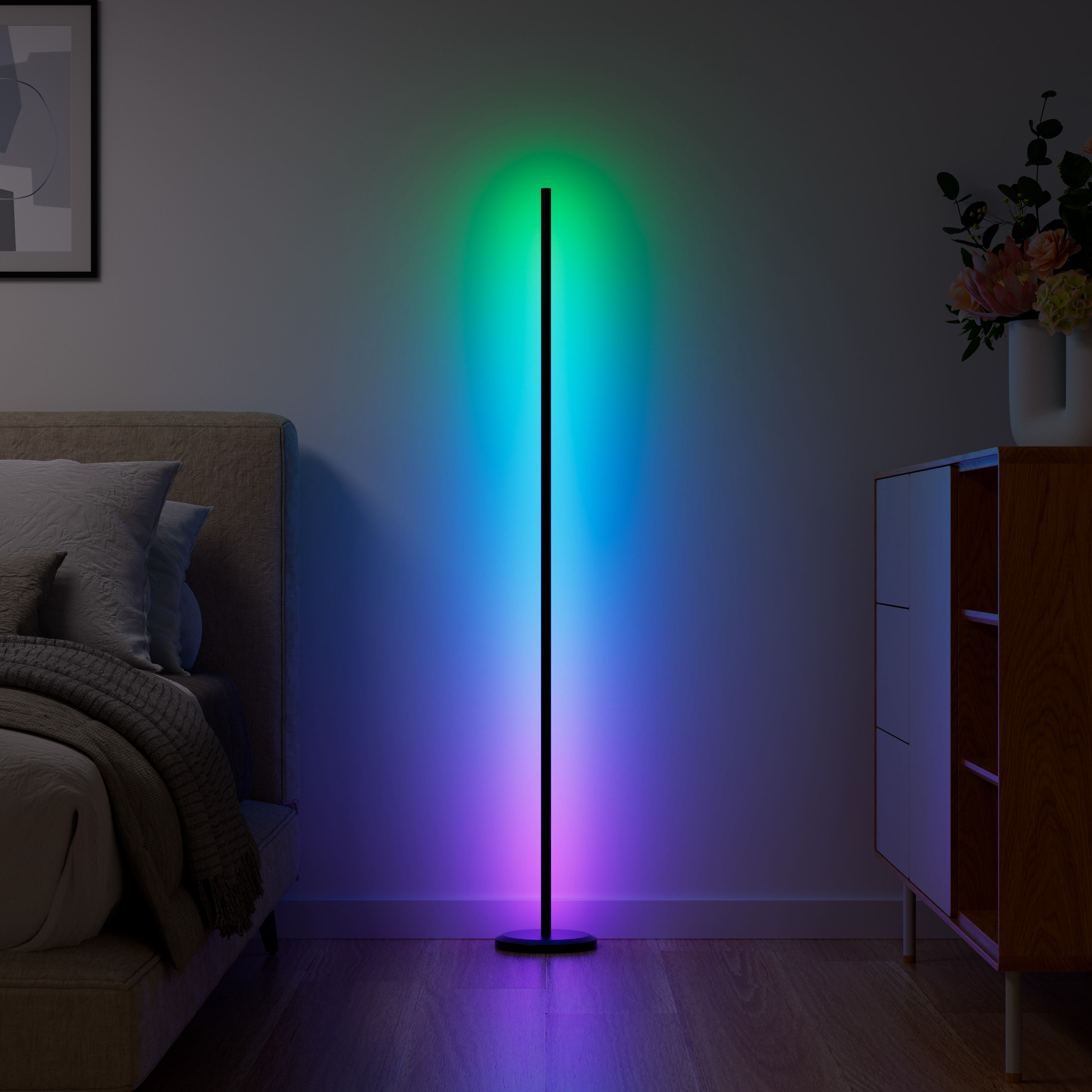 Nanoleaf's floor lamp in a bedroom, emitting a multicolor gradient light.