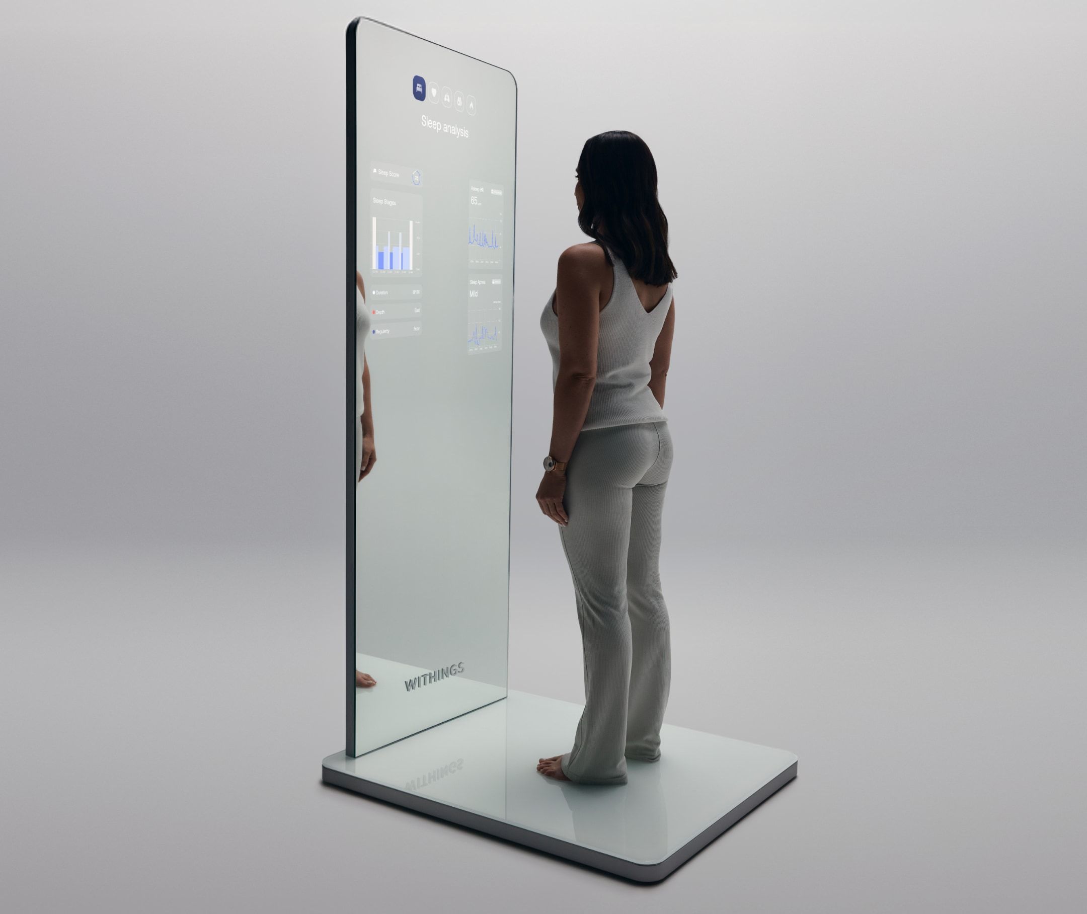 Woman standing on a Withings Omnia base, watching her stats on a full-body mirror interface.