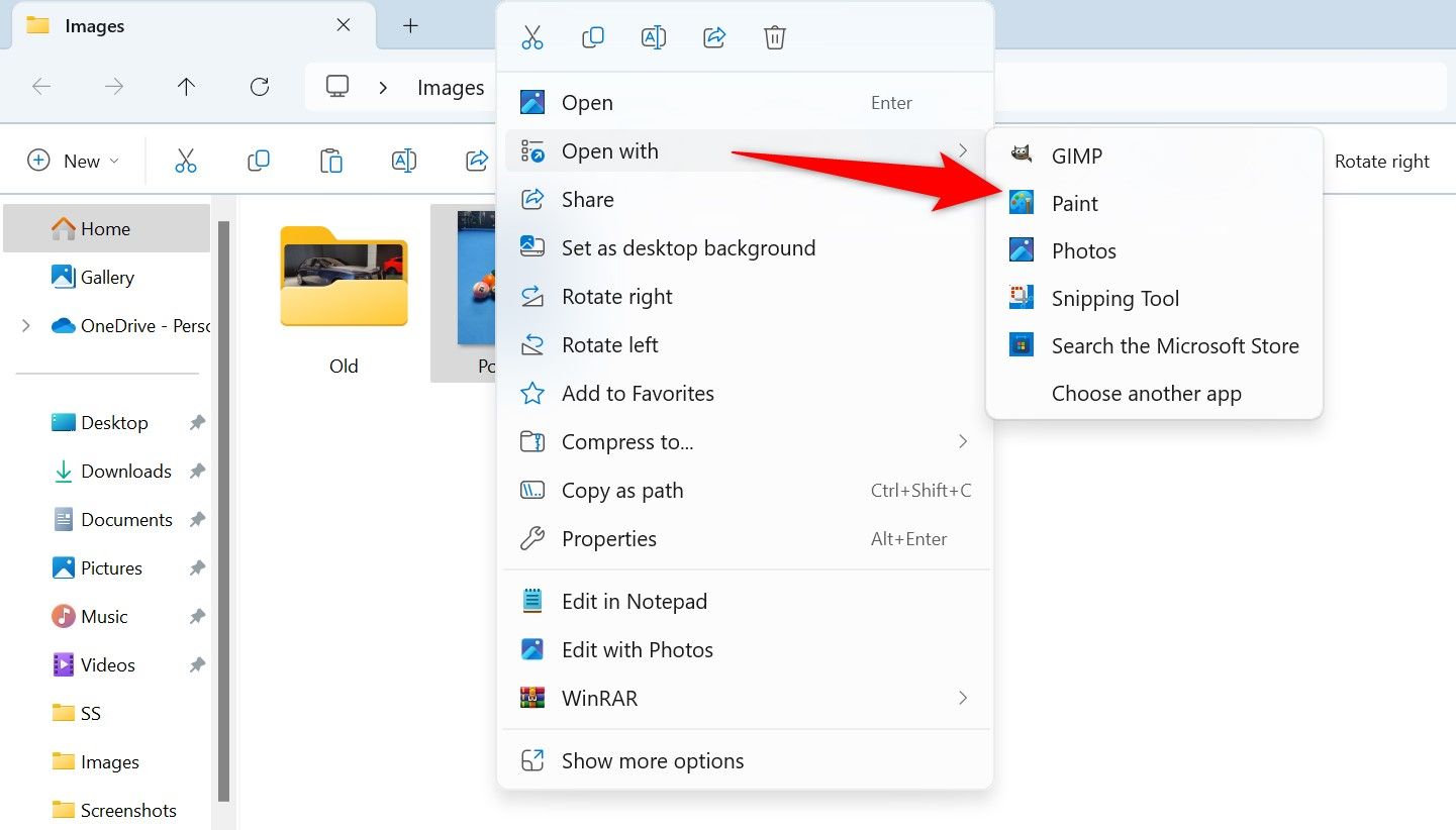 Open With > Paint selected for a photo in File Explorer.