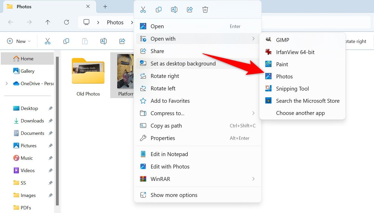 Open With > Photos highlighted for a photo in File Explorer.