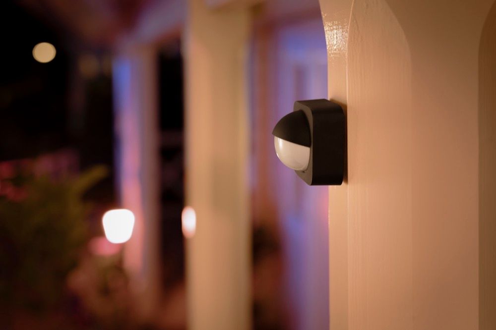 A motion sensor automatically switching on exterior lighting.