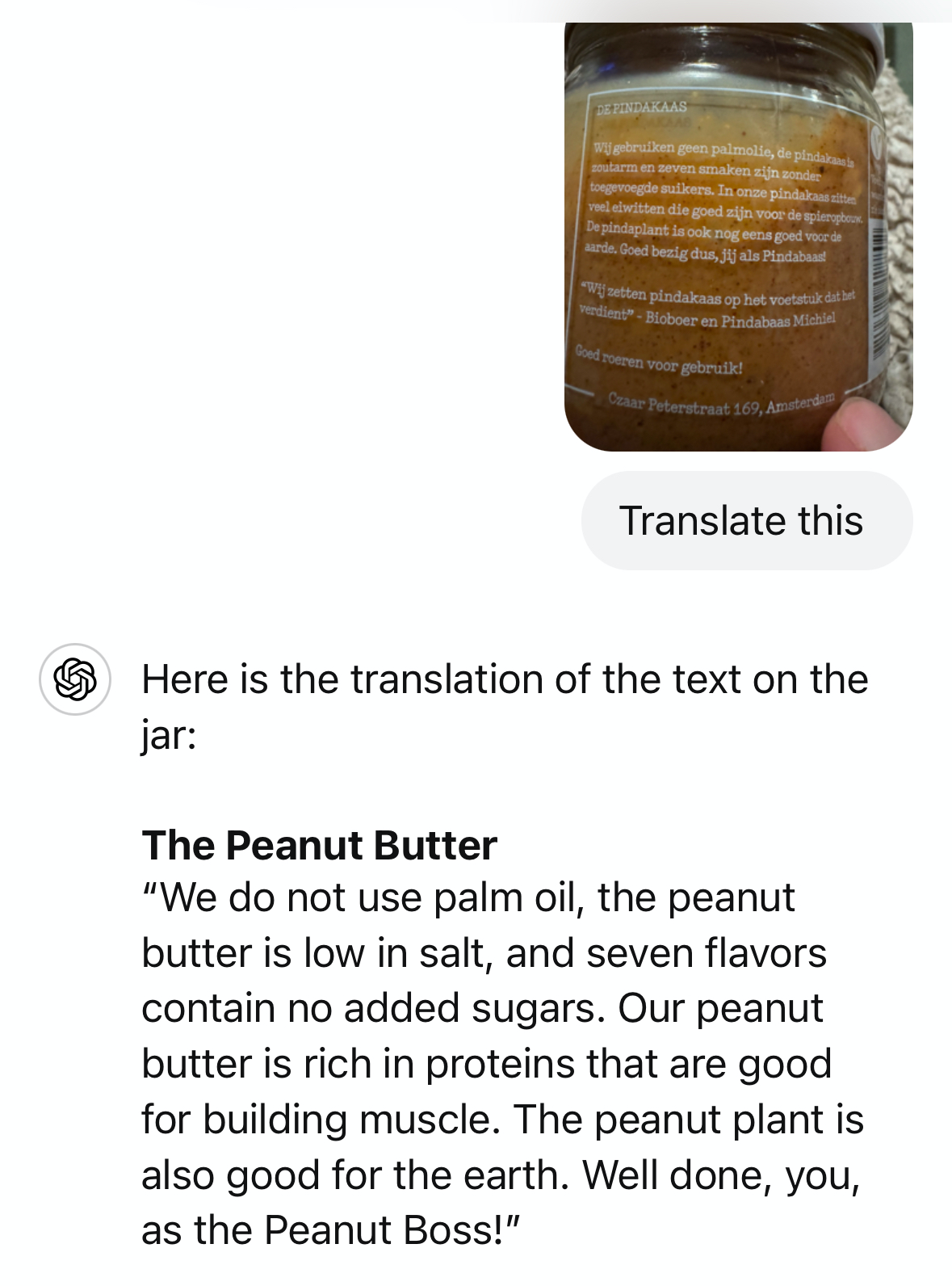 A translation of dutch text from a photograph of a jar of peanut butter in the ChatGPT app.