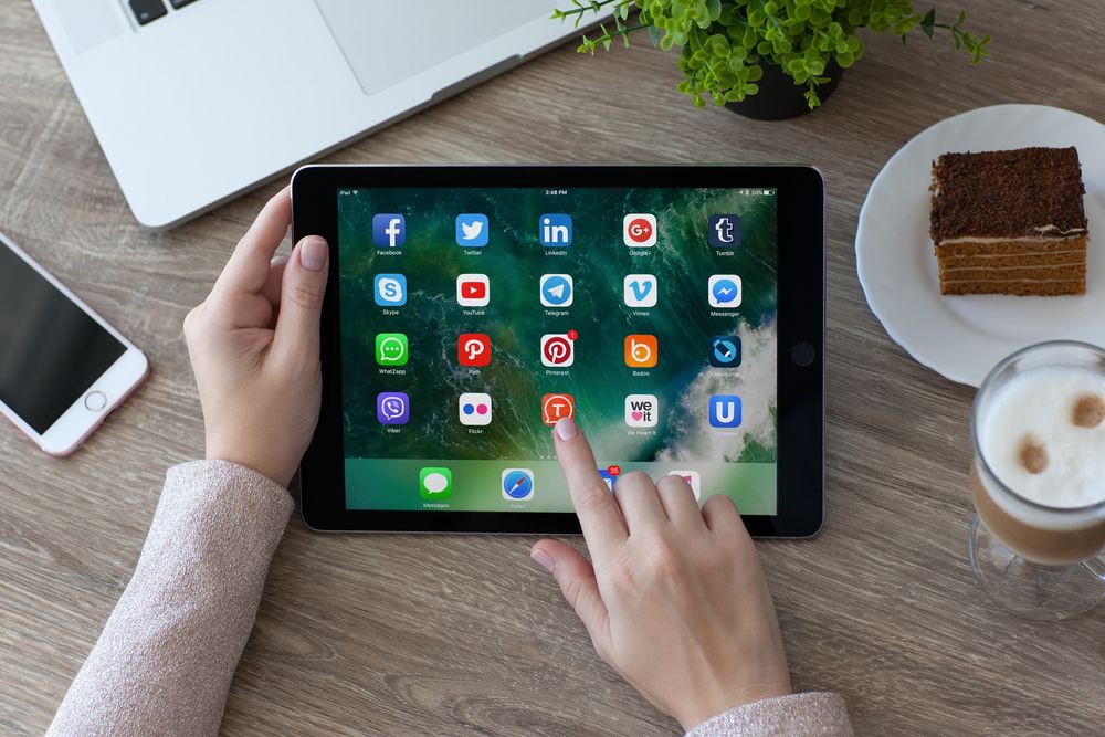 A woman's hands holding an iPad Pro 9.7