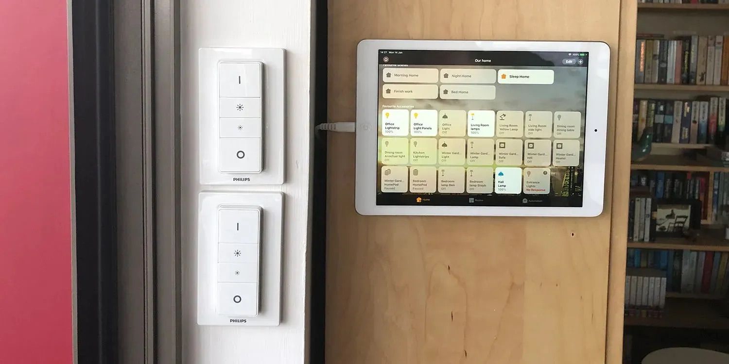 An older iPad repurposed as a wall-mounted control panel.