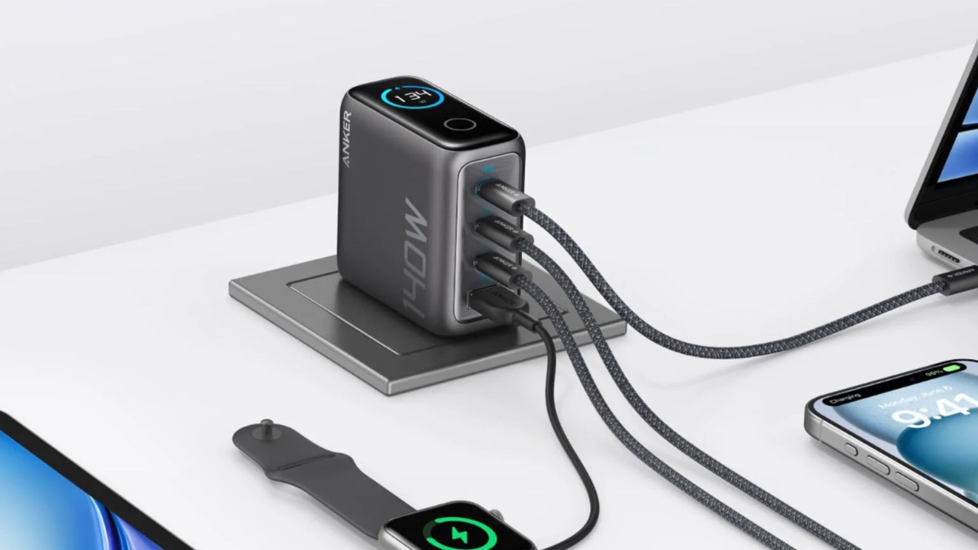 Anker wall charger plugged in on a desk. 