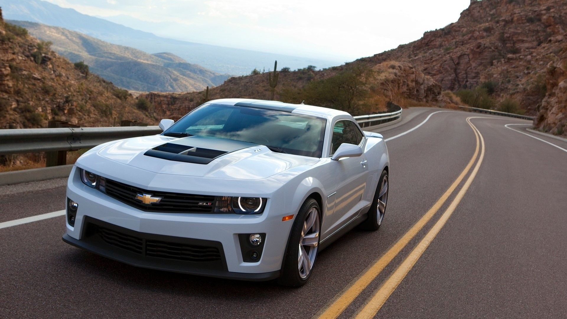 Front 3/4 action shot of a 2013 Chevrolet Camaro ZL1