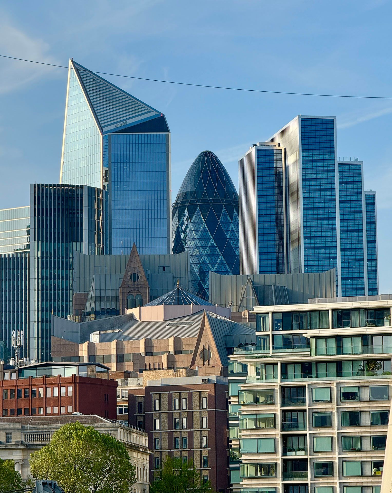 London skyscrapers with an ugly power or telephone line visible.