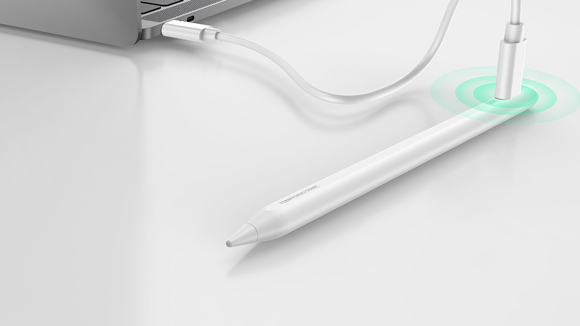 ESR's stylus next to a computer, charging via a USB-C cable.