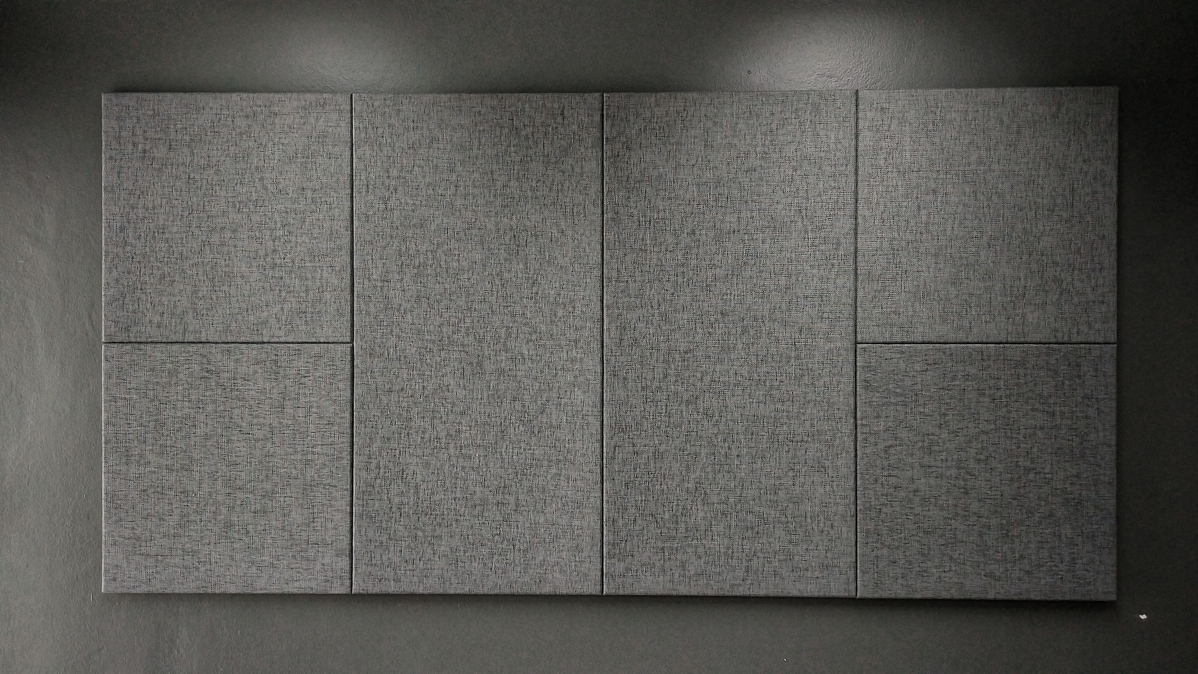 Gray acoustic panels on a wall.