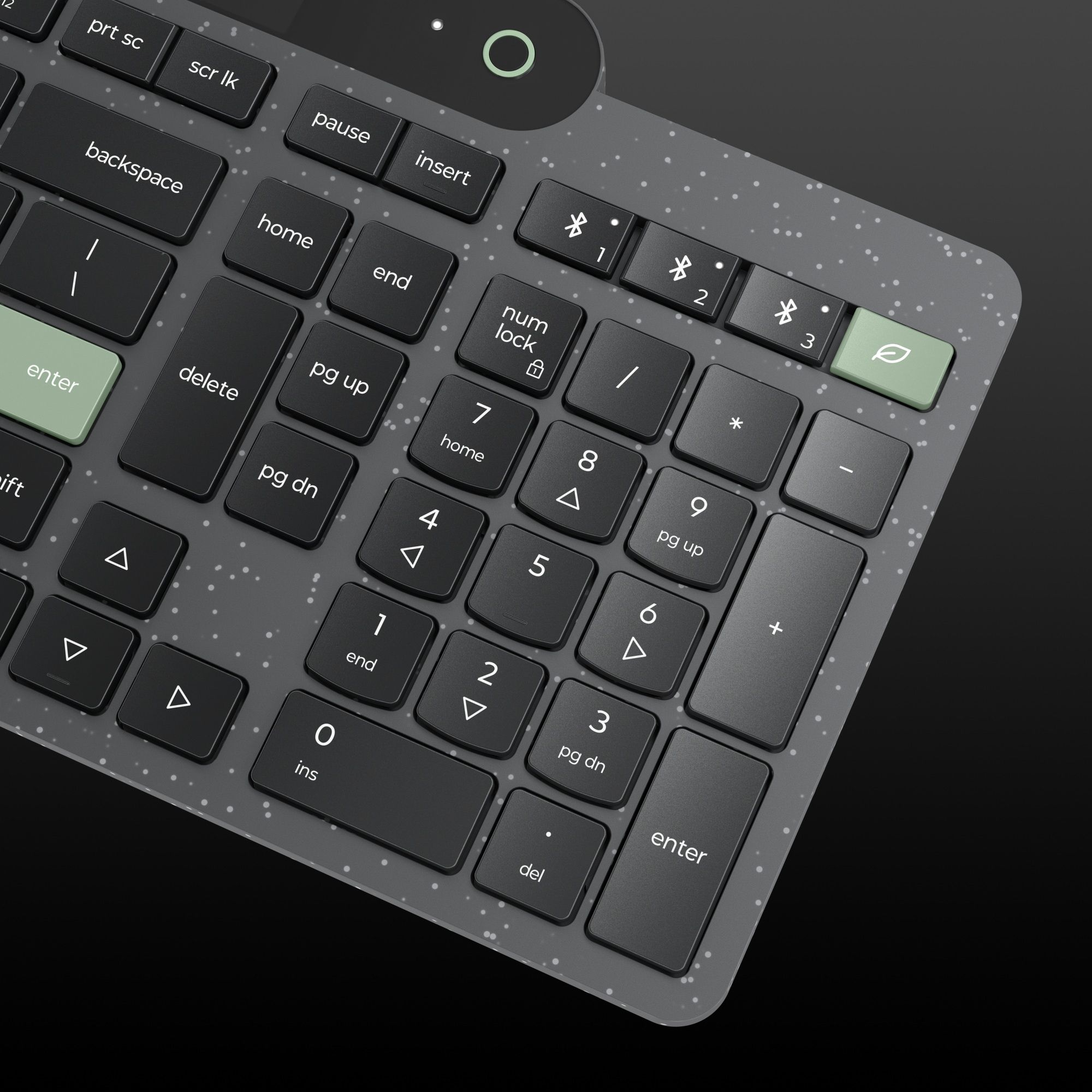 Closeup of the numpad on a Lenovo keyboard featuring the green leaf key.