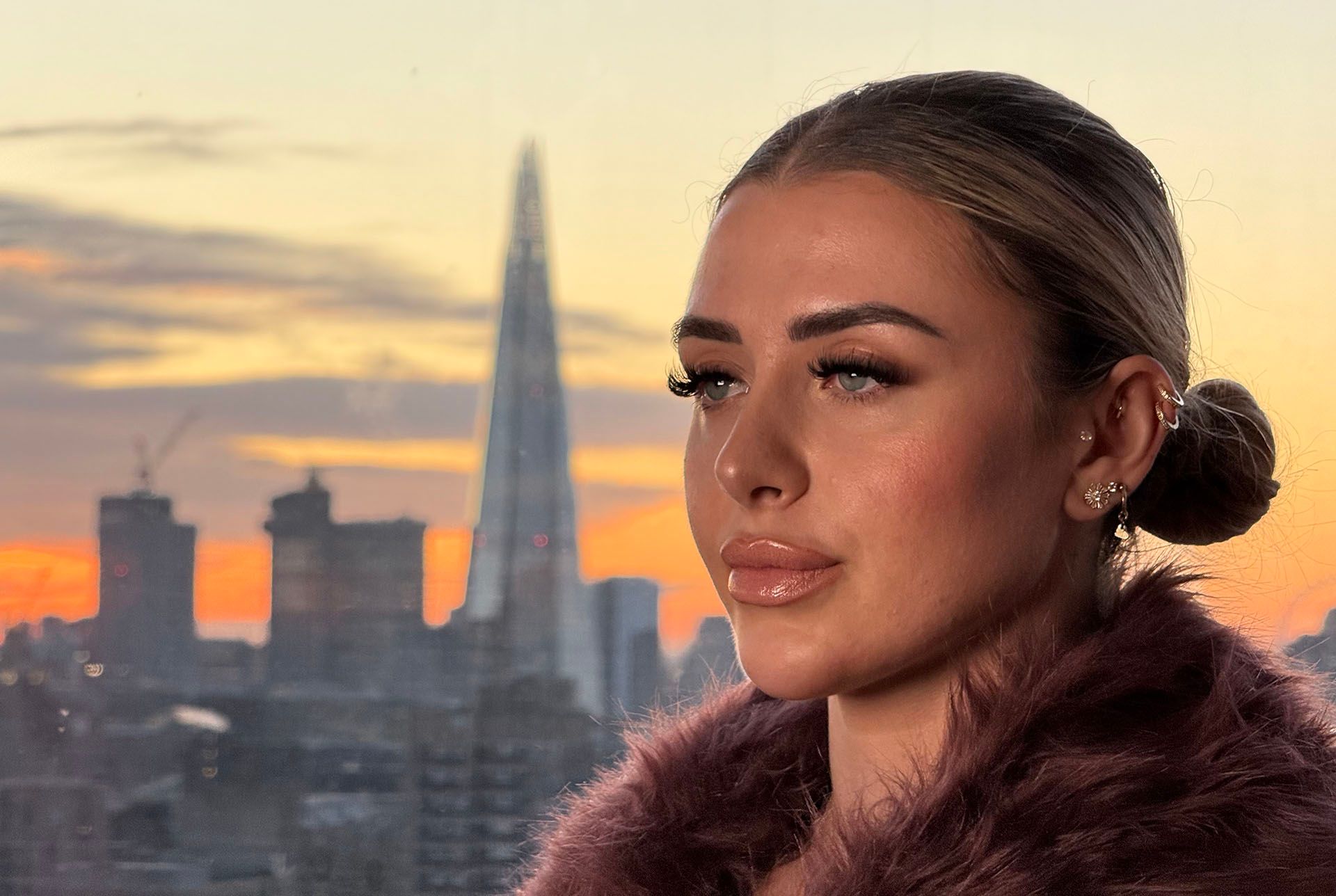 Original photo of a woman against the London skyline.