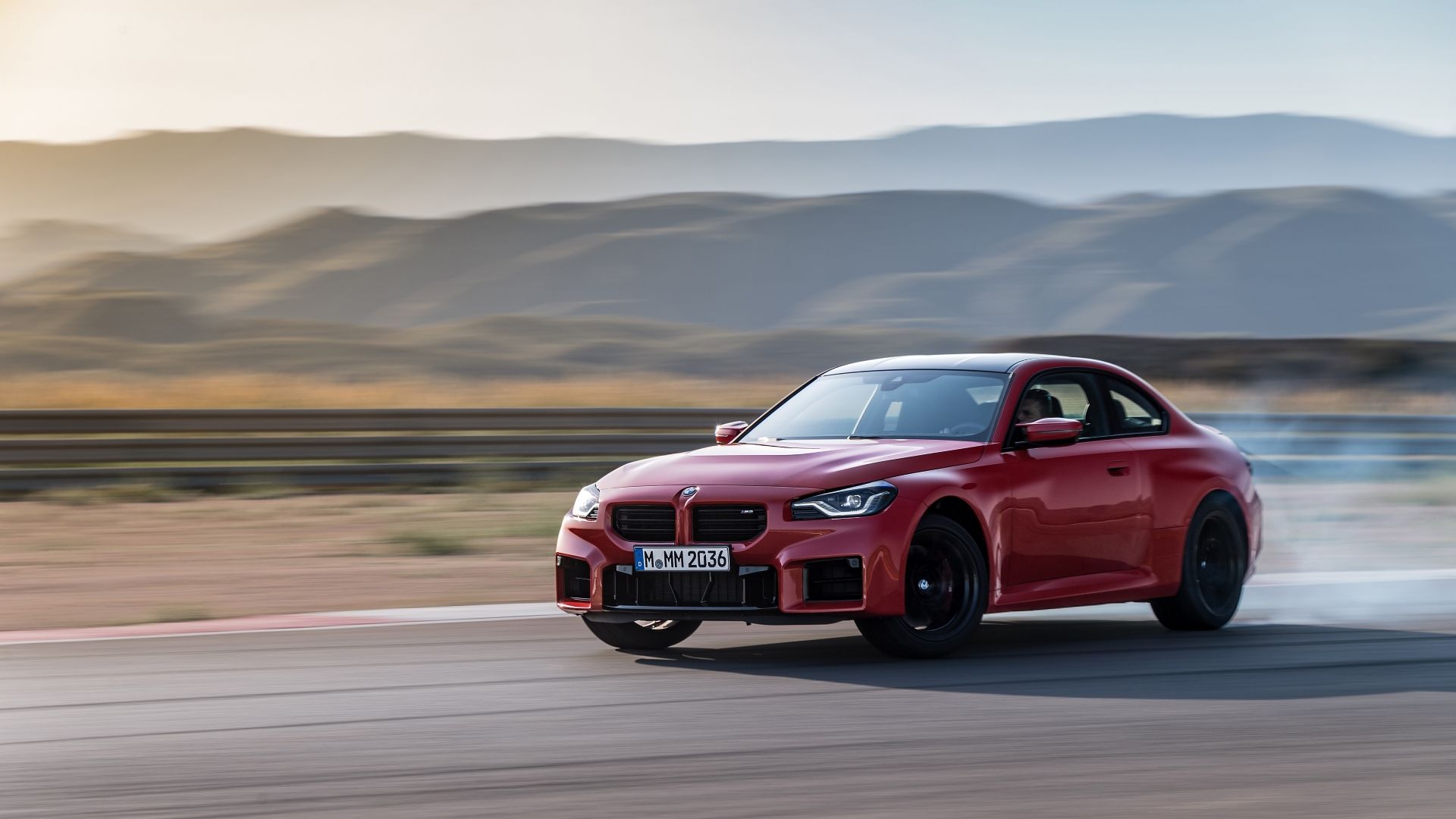 Front 3/4 action shot of a 2025 BMW M2