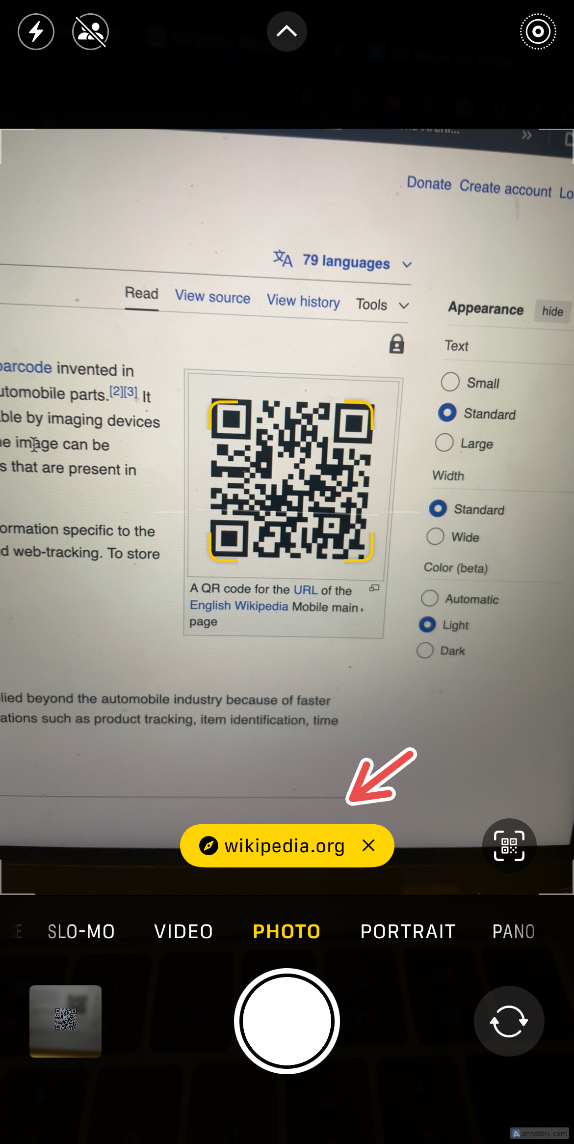 Using iPhone's Camera app to scan a QR code. 