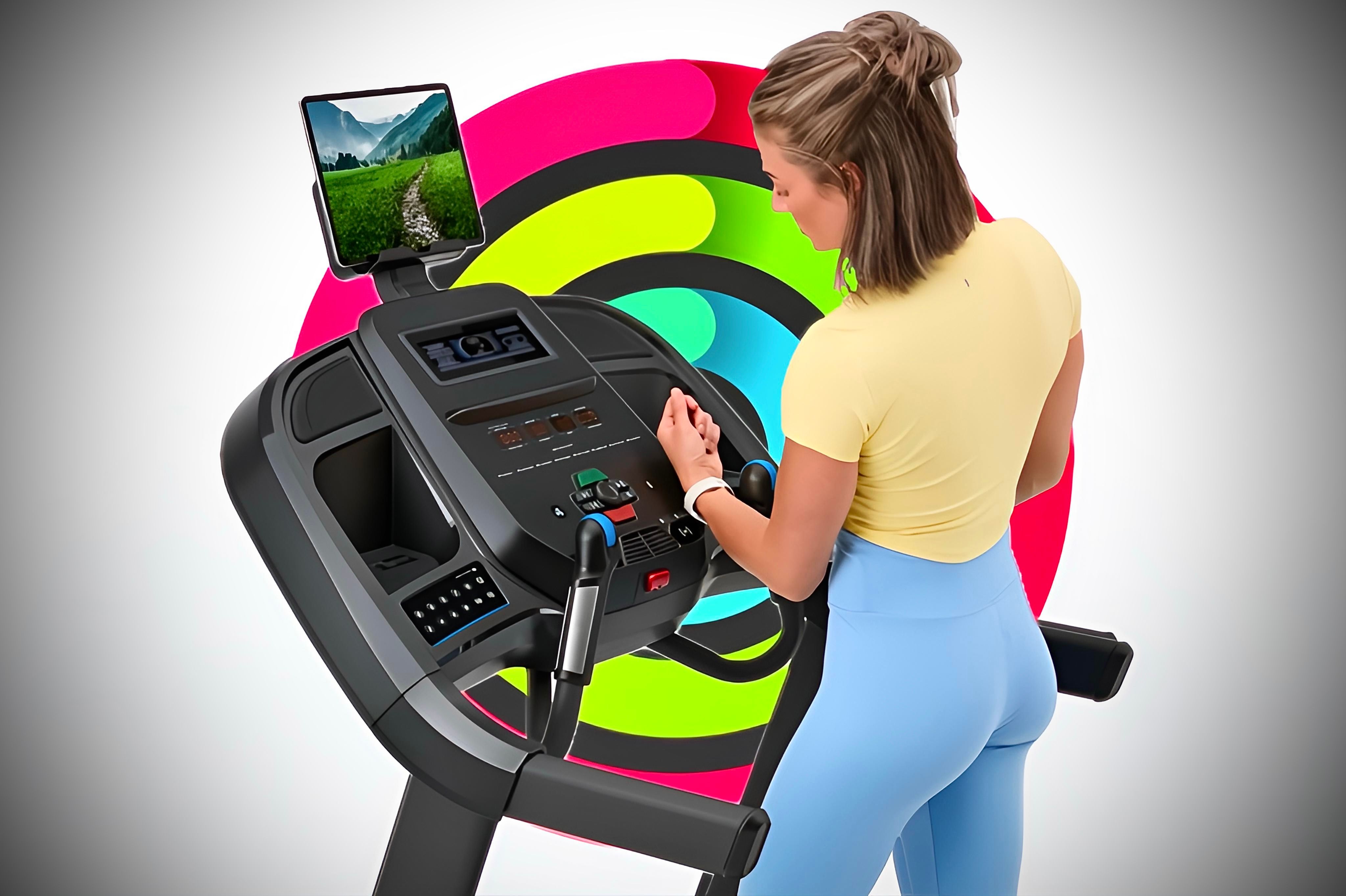 An individual connecting their Apple Watch to their treadmill in front of closed Activity Rings.