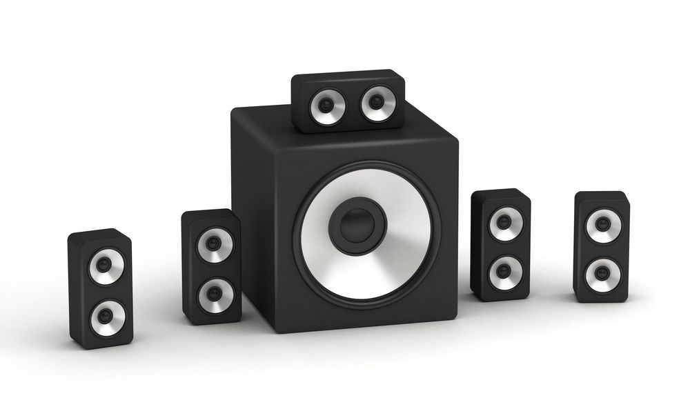 Set of speakers multimedia low cost 5.1 audio system on white background.