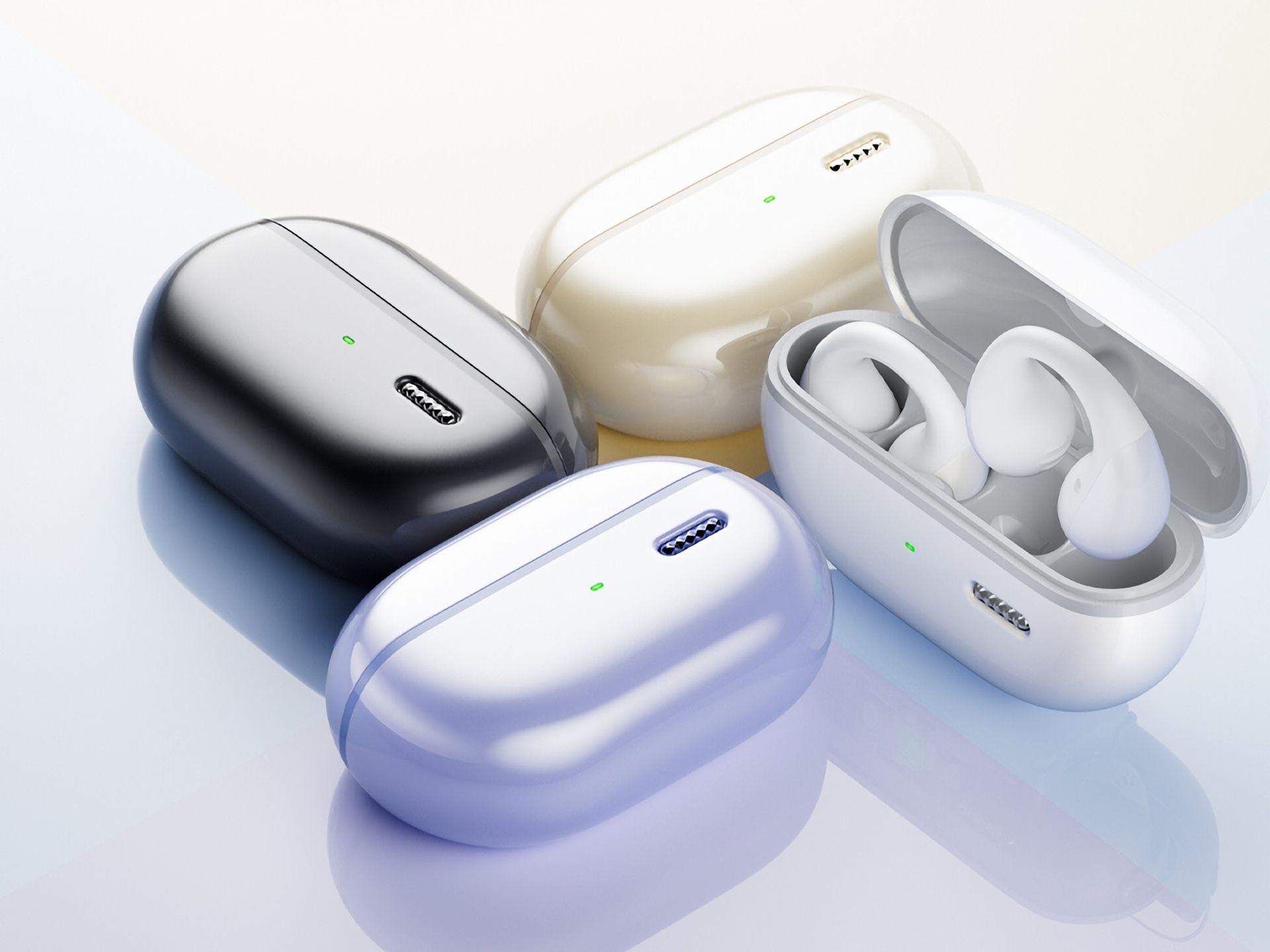 Four Soundpeats PearlClip Pro earbuds in their charging case, showcasing color finishes.