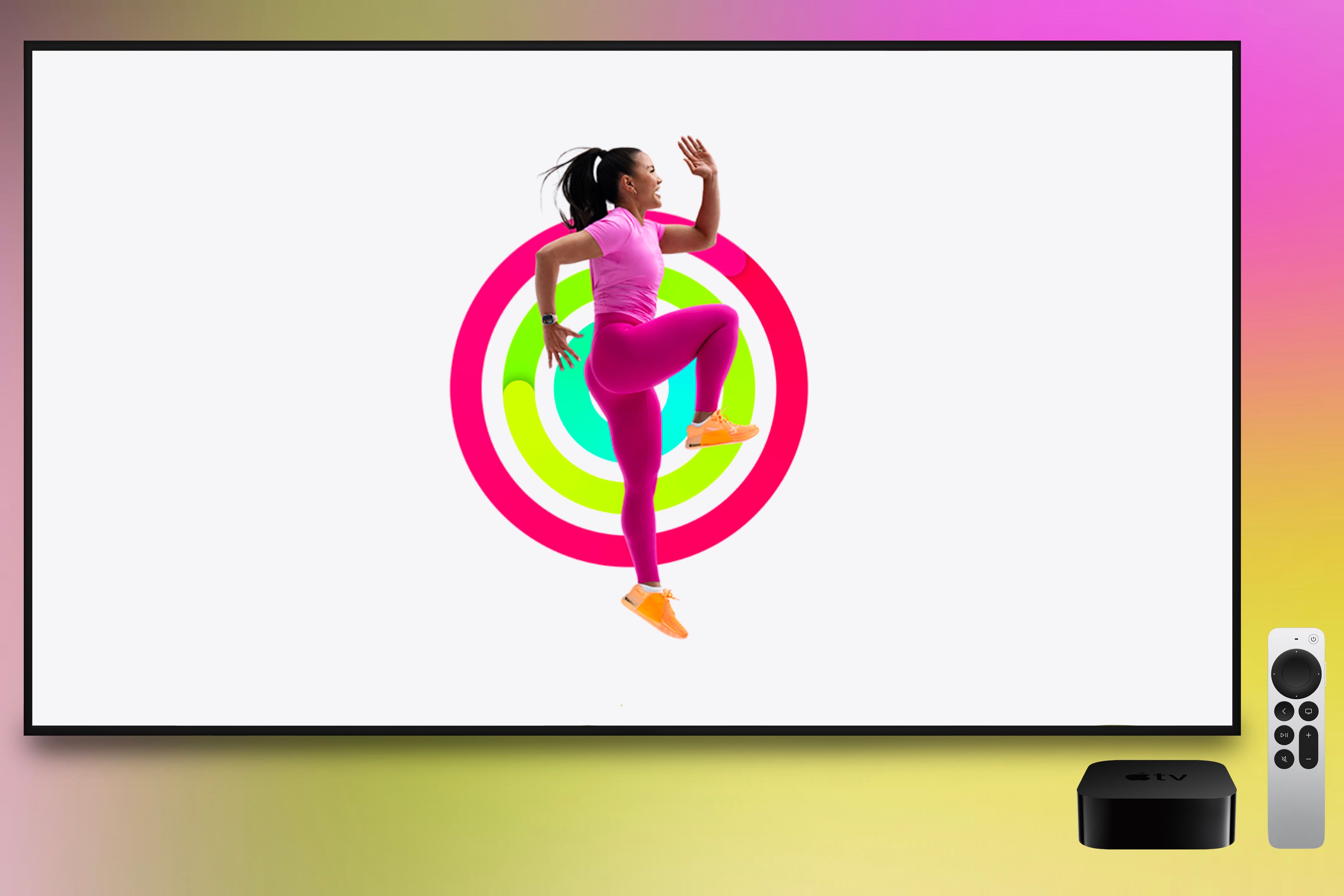 An Apple Fitness+ trainer working out in front of closed Activity Rings showcased on an Apple TV. An Apple TV box and remote are present while being in front of a colorful background.