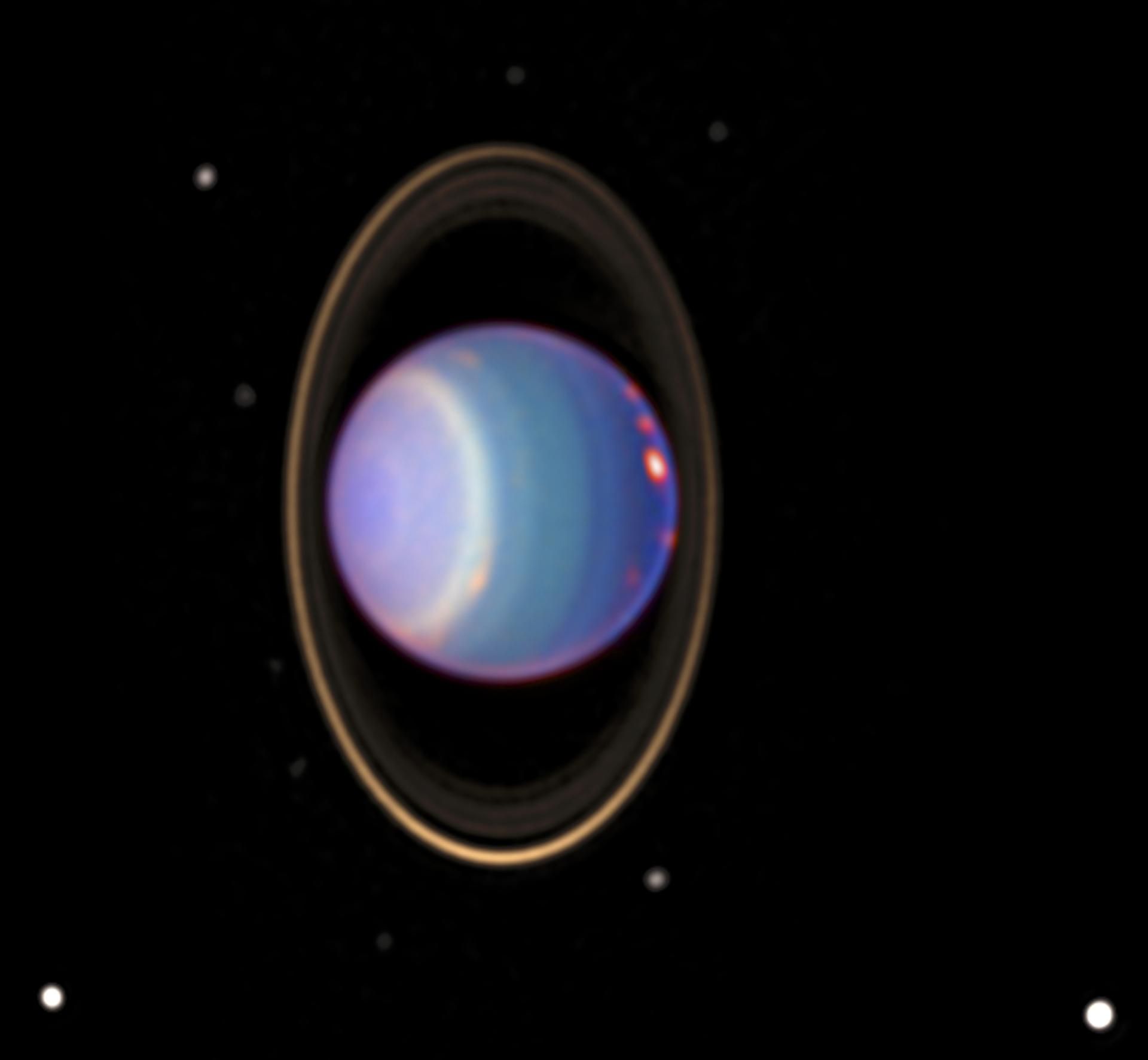 A recent Hubble Space Telescope (HST) view reveals Uranus surrounded by its 4 major rings and 10 of its 17 known satellites.