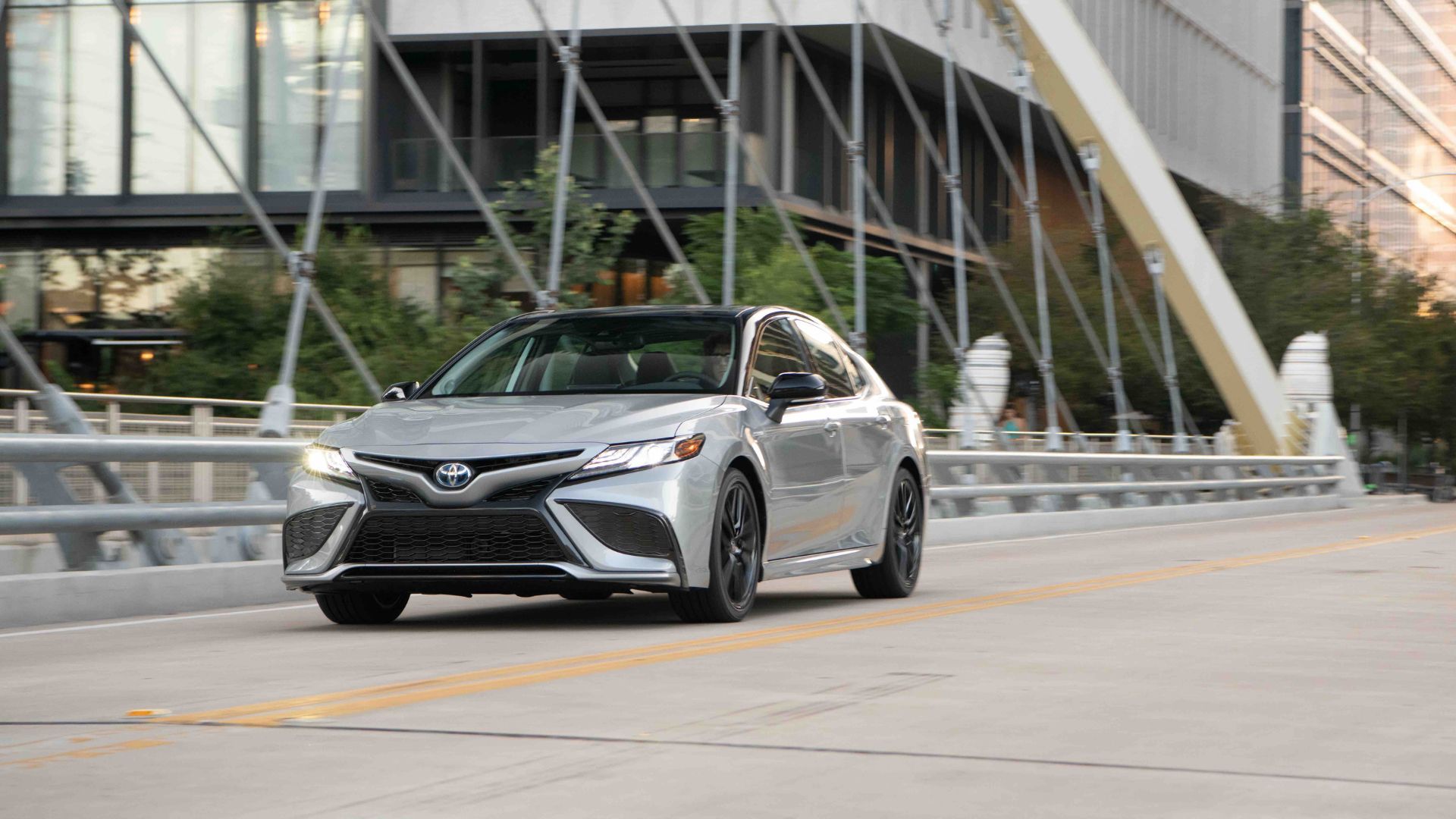 Silver 2022 Toyota Camry city driving.