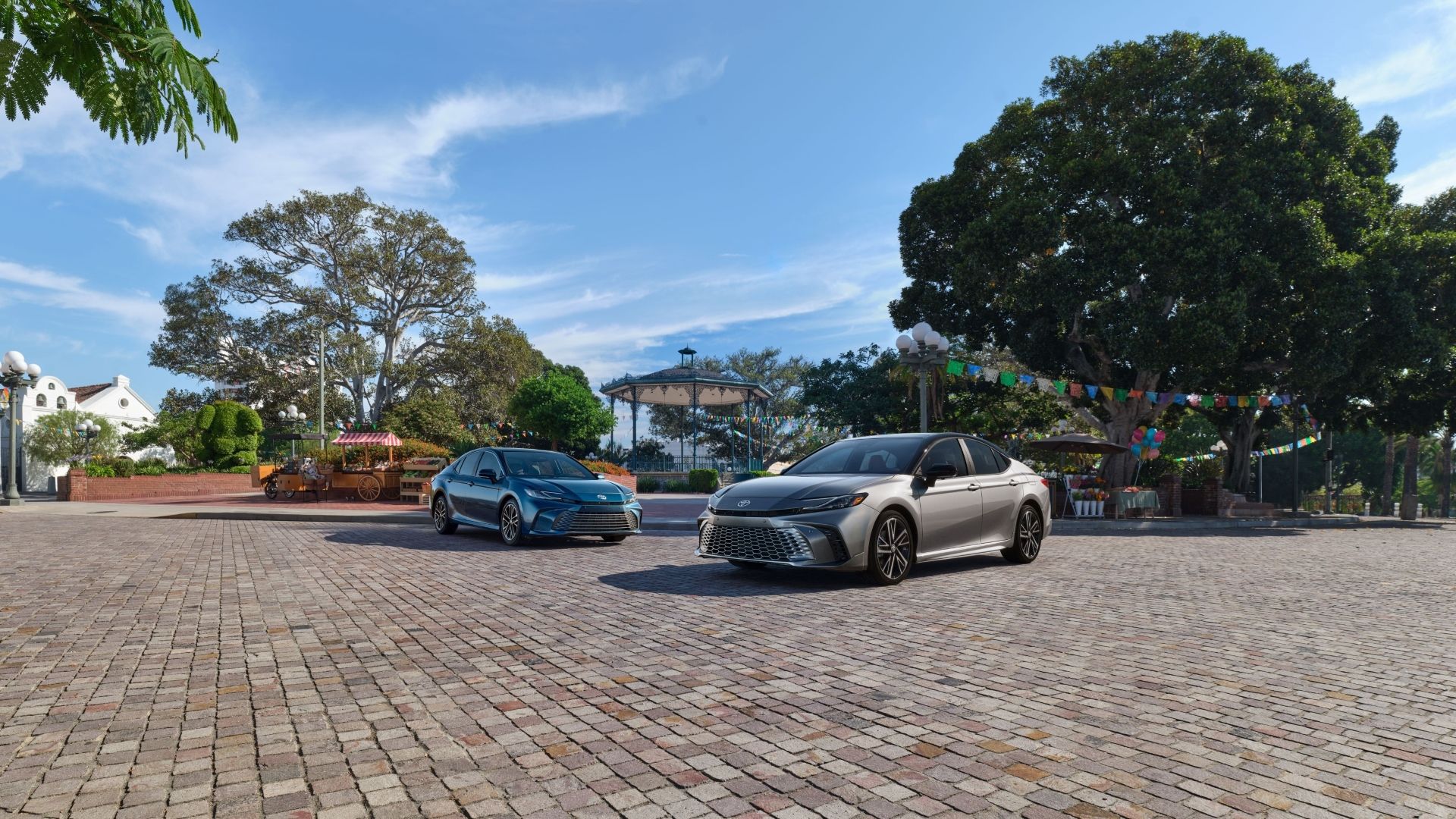 Front 3/4 shot of two 2025 Toyota Camrys parked side by side