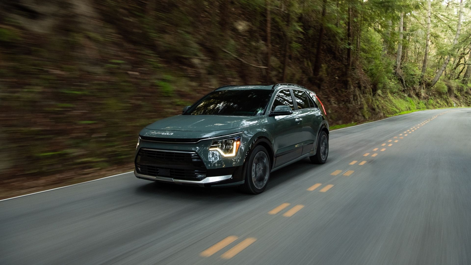 Front 3/4 action shot of a 2025 Kia Niro