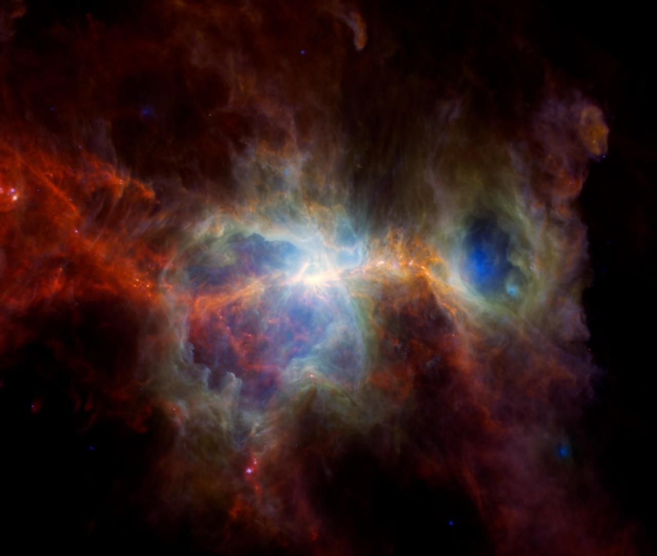 A composite image of the Orion Nebula produced using previously released data from three telescopes.