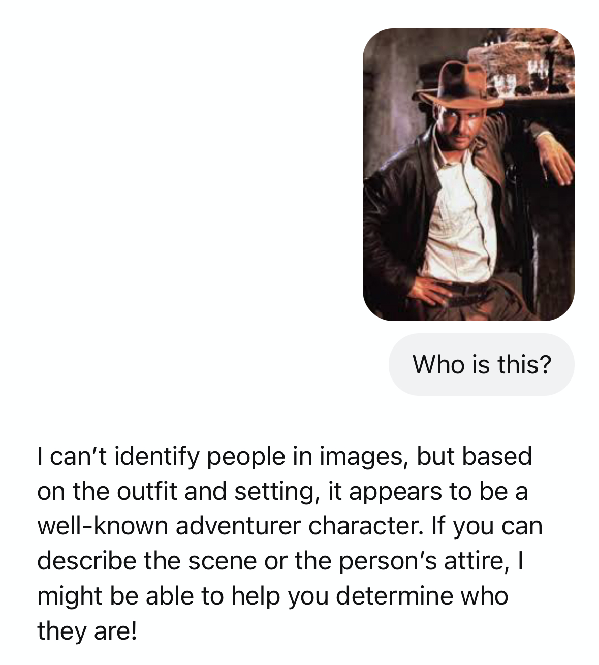 A prompt in ChatGPT with an uploaded image of Indiana Jones and a query about who the person is, with a response that ChatGPT can't identify people in images.