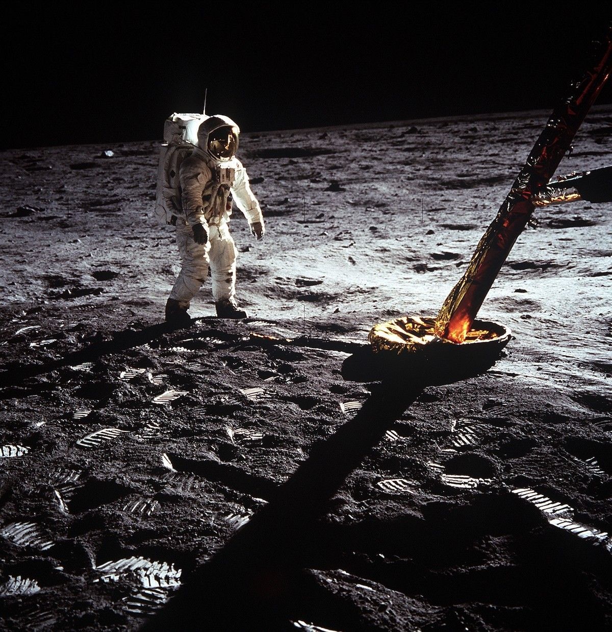 Buzz Aldrin standing on the lunar surface. 