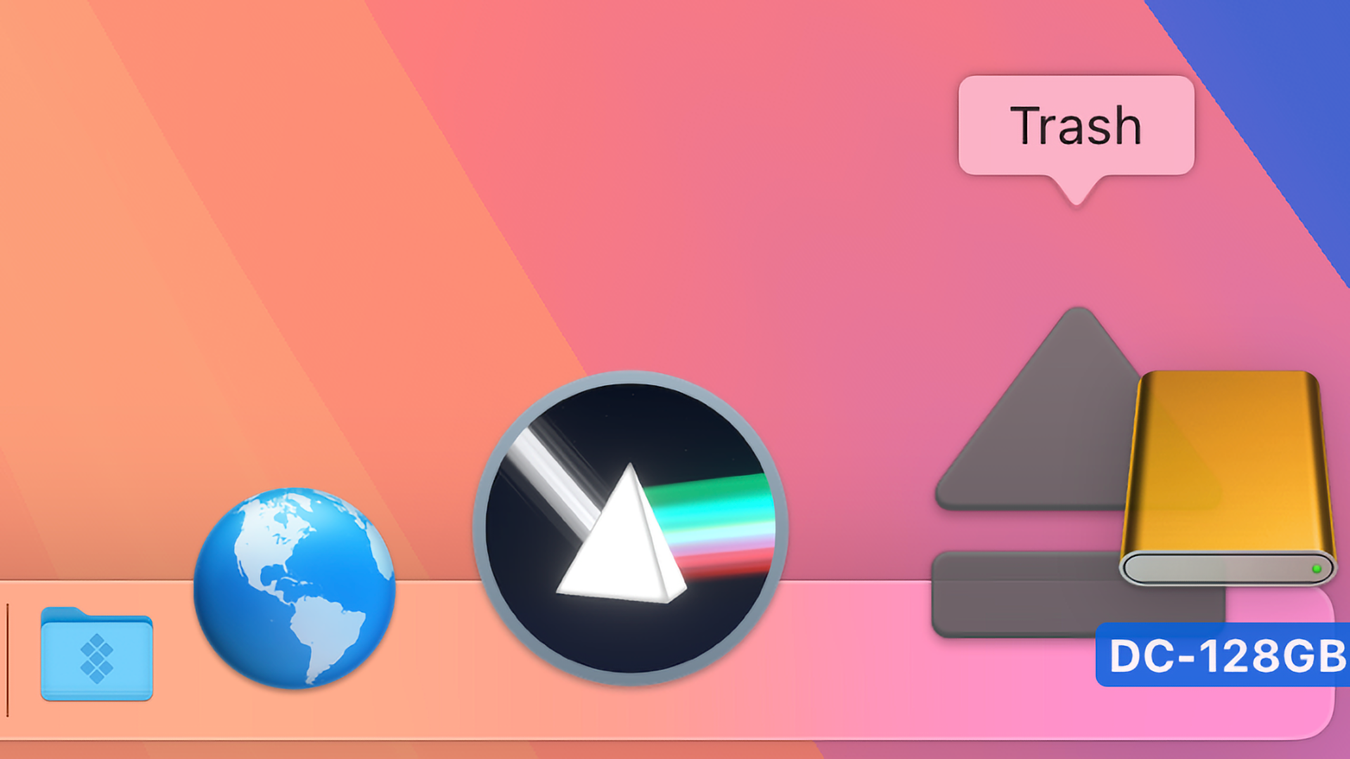 Ejecting an external drive in macOS Sequoia 15.3 by dragging its icon over the Trash in the Dock.