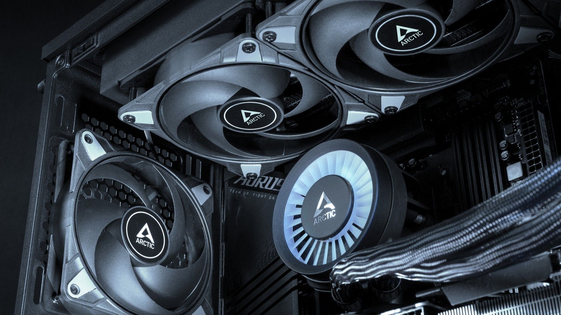 Three ARCTIC P12 Max fan mounted inside a PC case. 