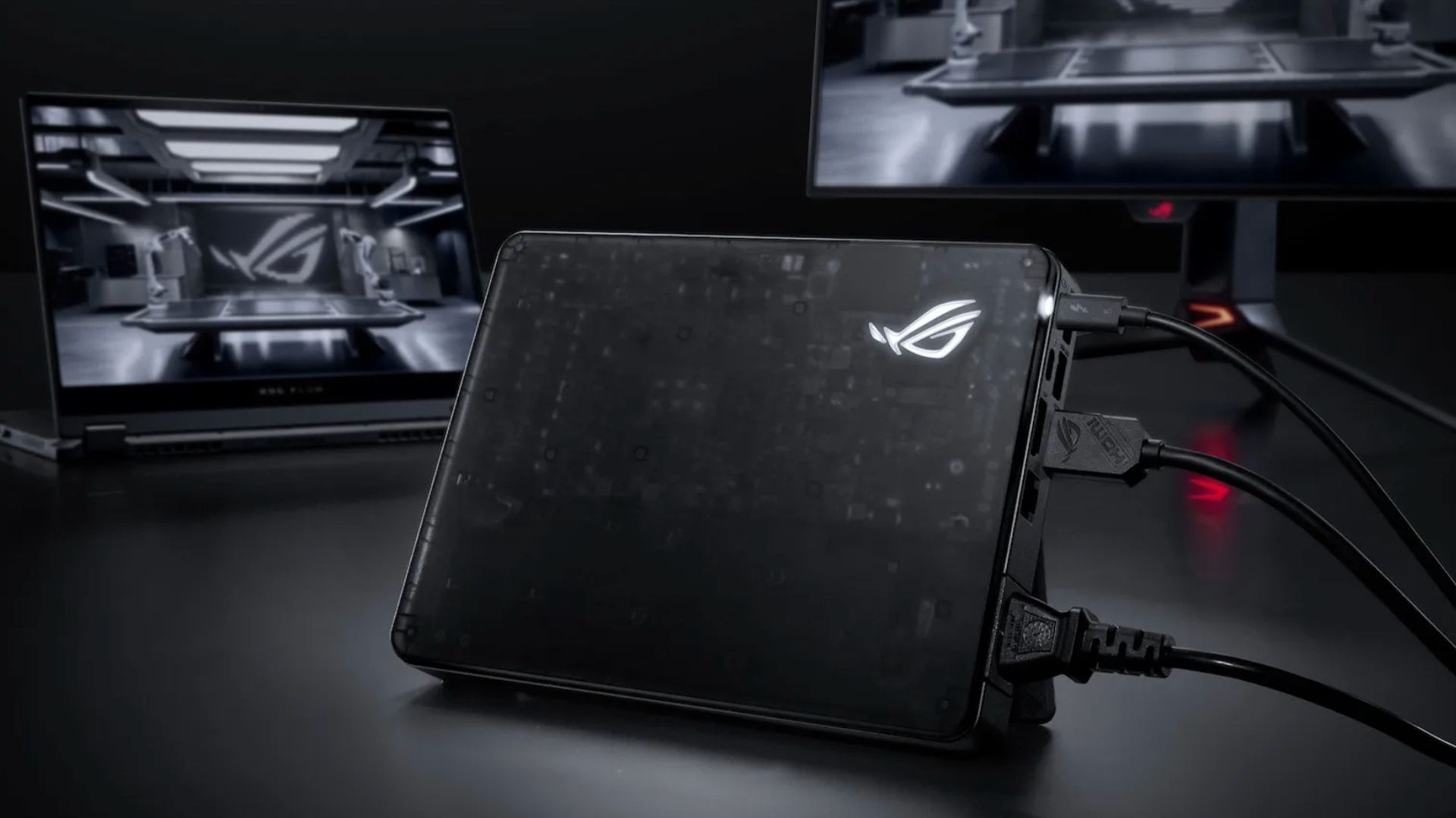 An ASUS XG Mobile External GPU Connected to a laptop and a monitor.