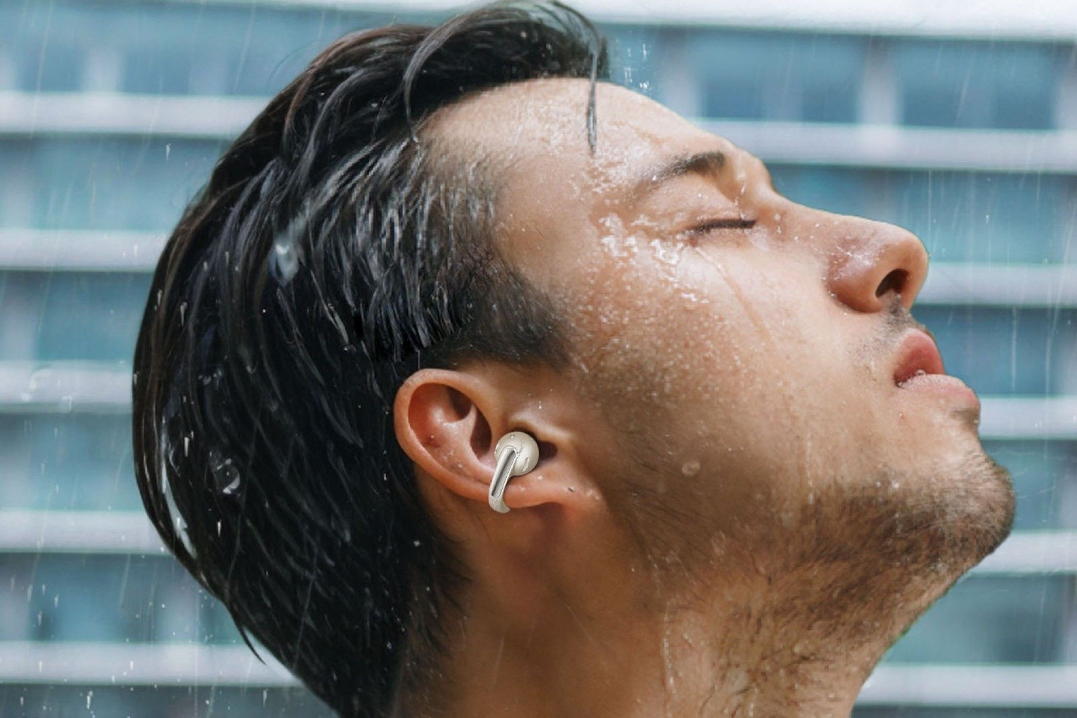 A Man Wearing the Baseus Bowie MC1 Earbuds in the Rain