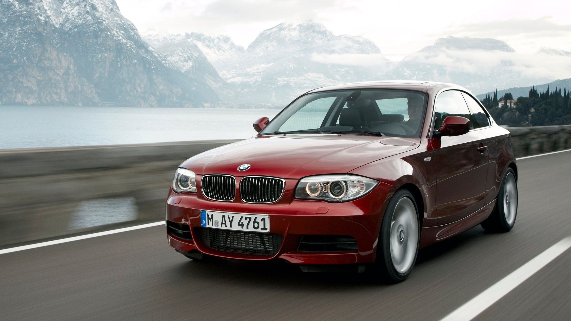 Front 3/4 action shot of a 2012 BMW 1-Series Coupe