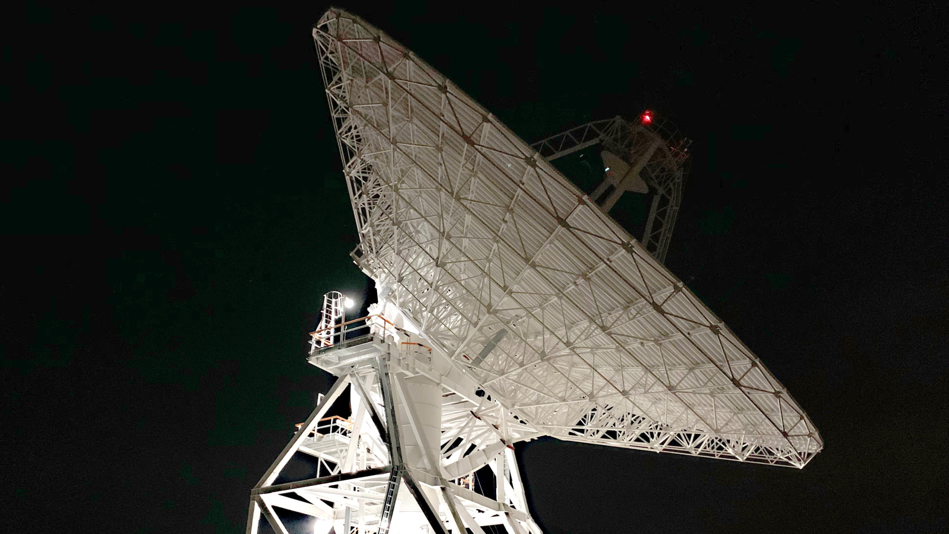 A dish from the NASA Deep Space Network at night.